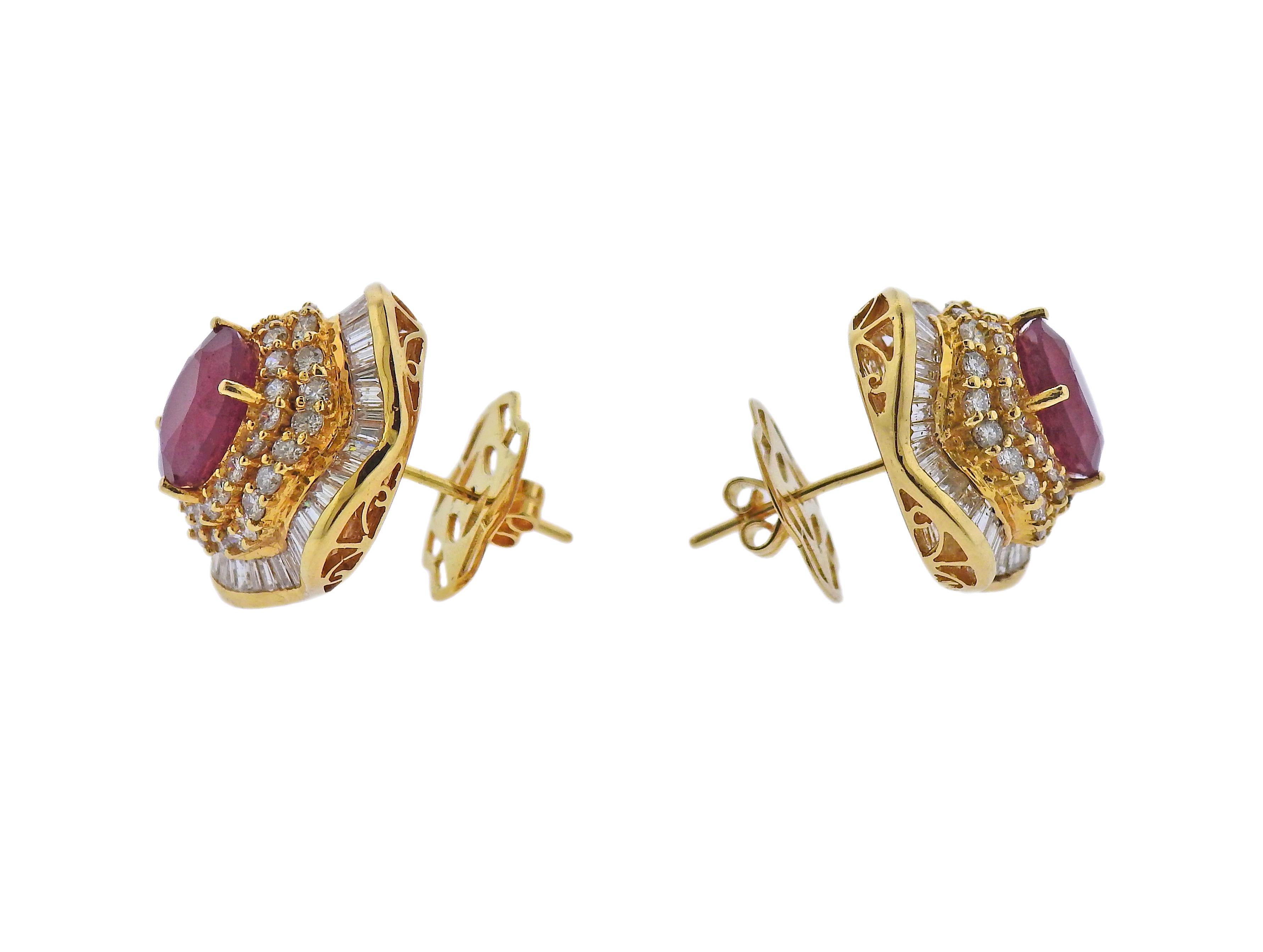 Pair of 18k gold cocktail earrings, set with 10.8 x 9.7mm rubies, surrounded with approx. 3.20ctw in diamonds. Earrings are 26mm x 24mm. Marked 18k. Weight - 18.8 grams.