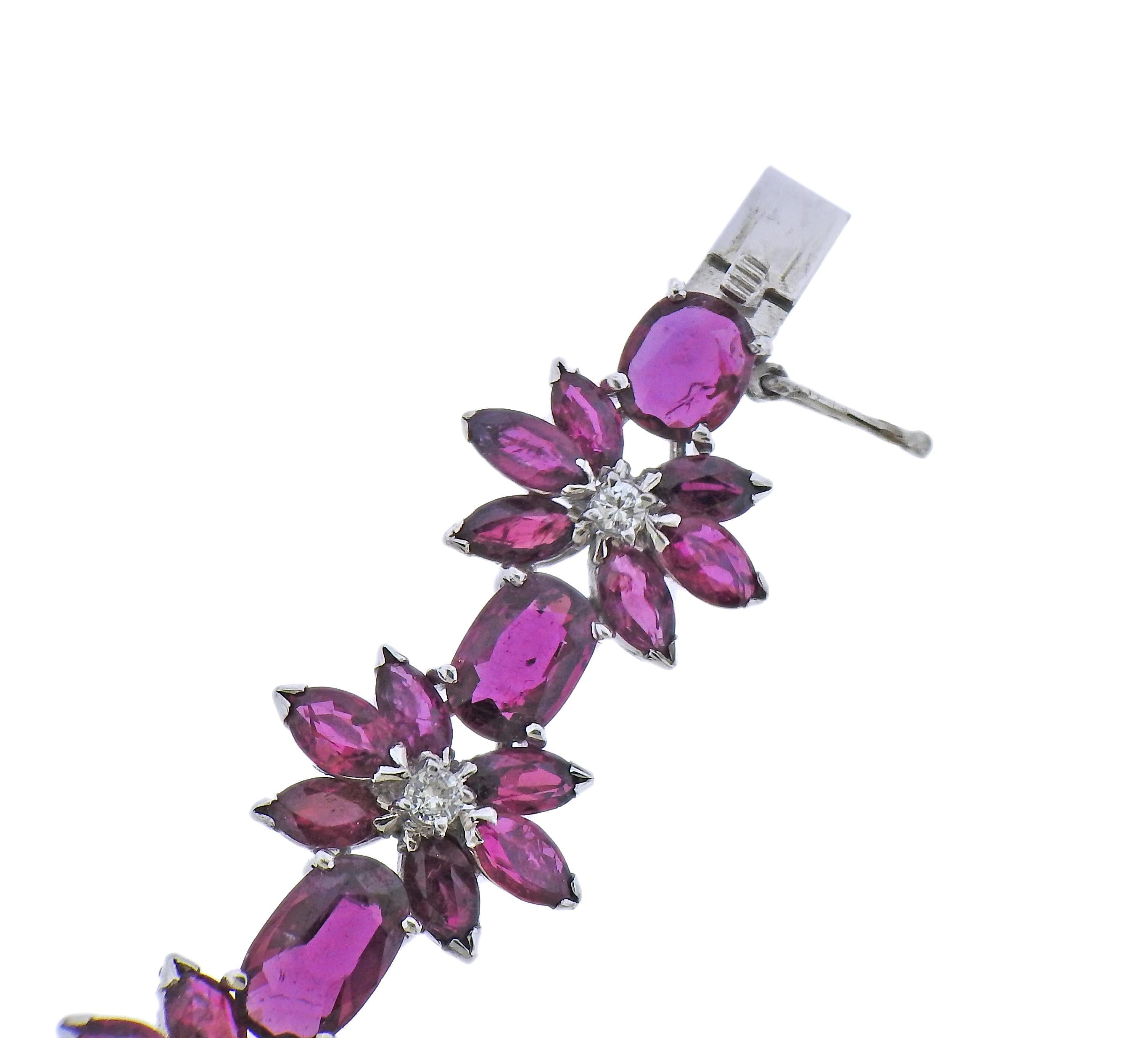 18k white gold flower bracelet with rubies and approx. 0.33ctw in diamonds. Bracelet is 6.5