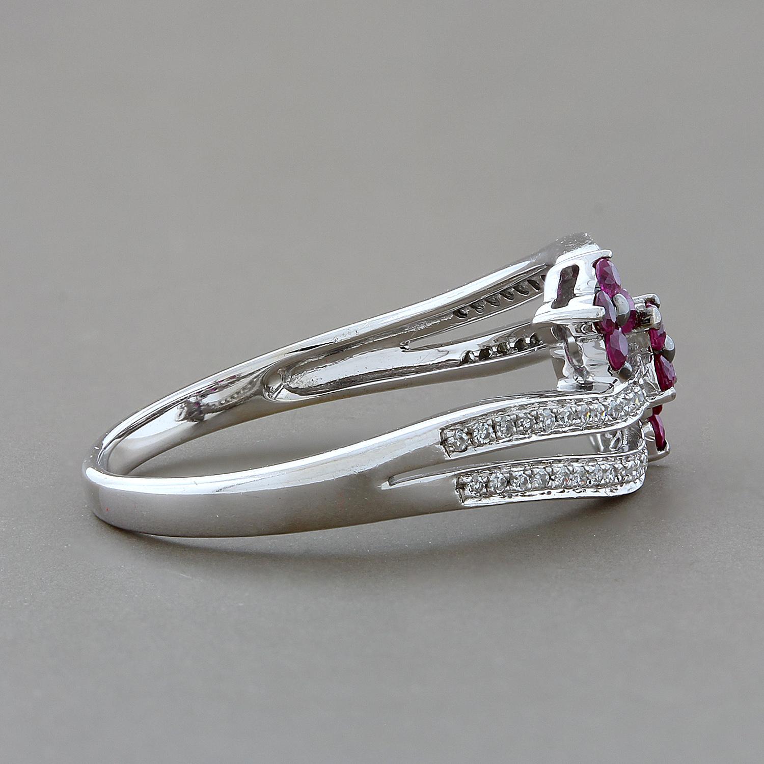 Fun and feminine! This ring features 0.24 carats of red rubies creating three florets. Each floret sits on its own band which then converge into one seamless shank that is set in 14K white gold and accented by 0.13 carats of diamonds. 

Currently