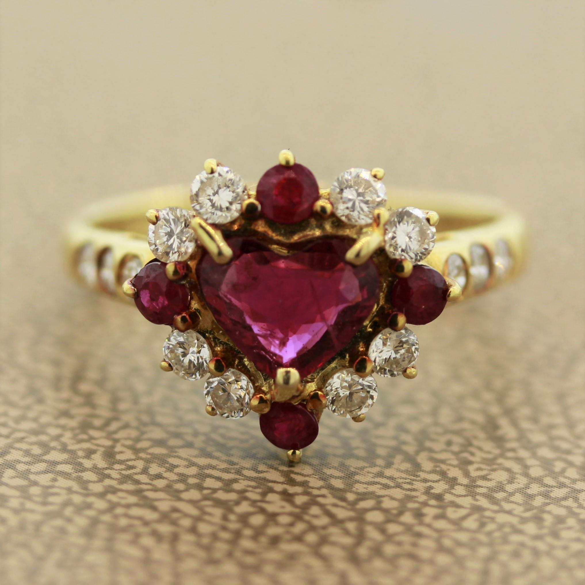 A sweet ring made with love featuring a 0.75 carat heart shaped ruby. It is accented by 4 smaller round cut rubies weighing 0.35 carats as well as round brilliant cut diamonds weighing 0.56 carats. Made in 18k yellow gold, this ring will bring love