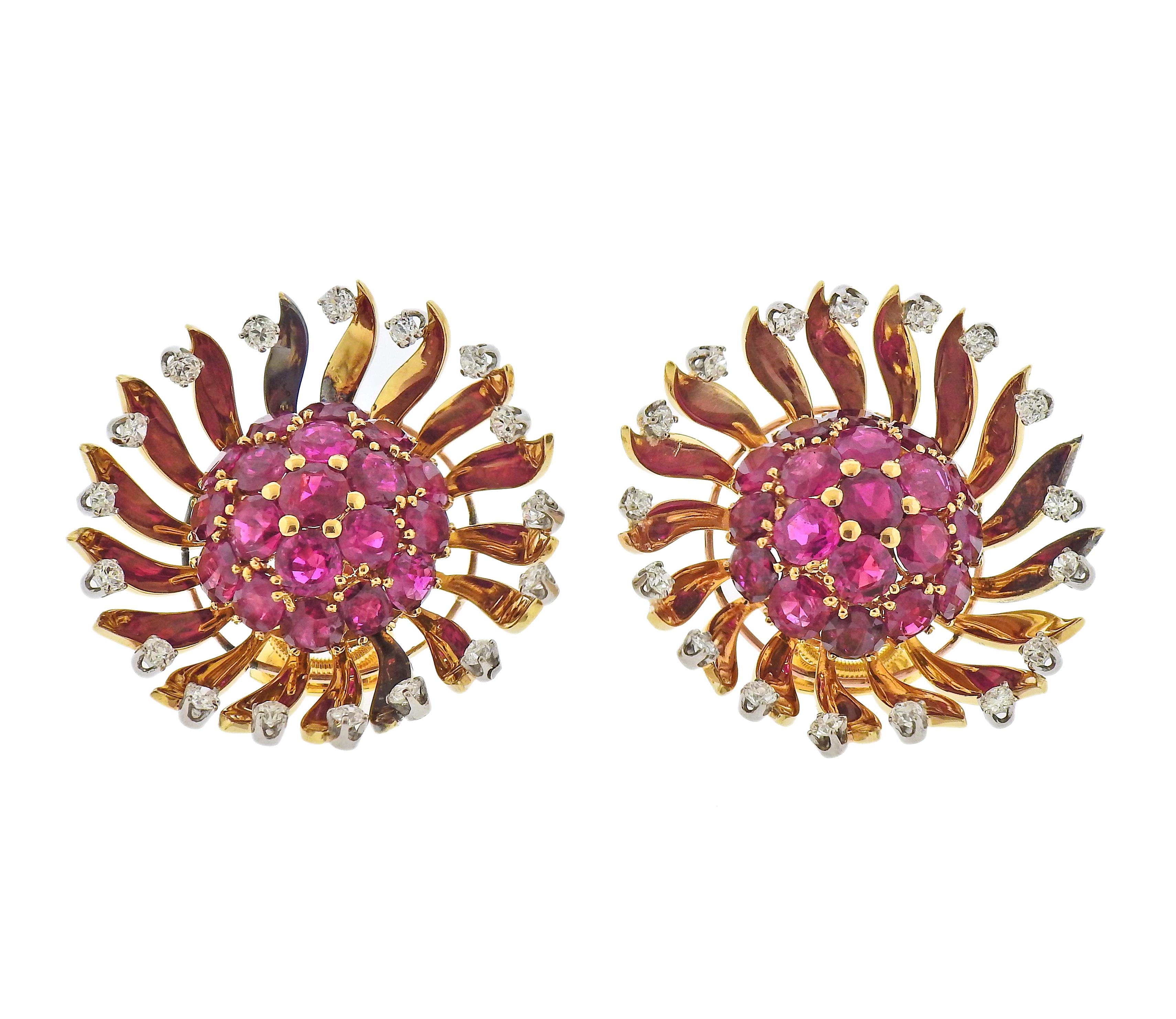 Pair of large 18k gold earrings with rubies and approx. 1.00ctw in diamonds. Earrings are 35mm in diameter. Weight - 35.2 grams. 