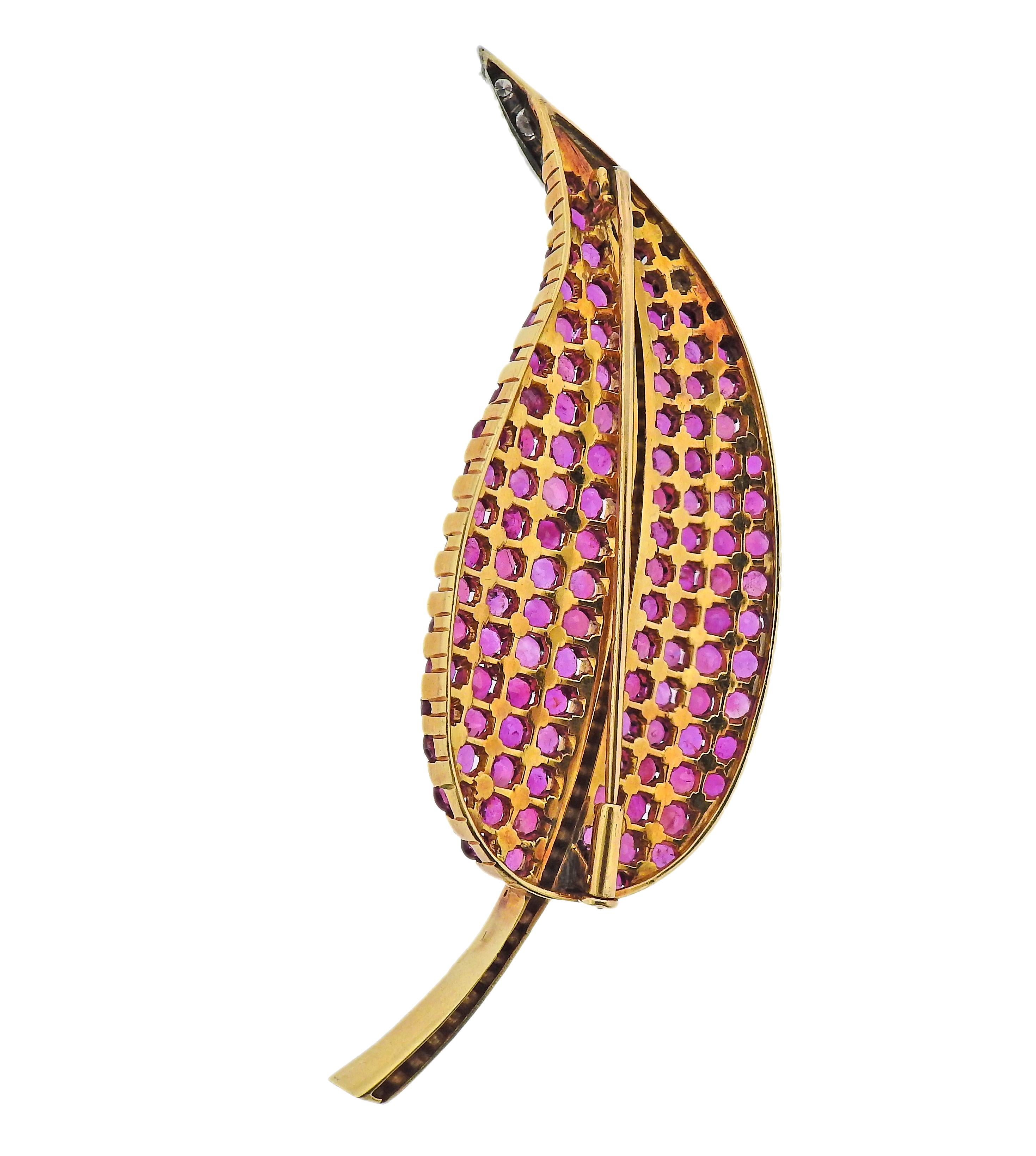 Large leaf motif 18k gold brooch, set with  rubies and approx. 0.40ctw in diamonds. Brooch is 83mm x 30mm. Weight - 30.2 grams. 