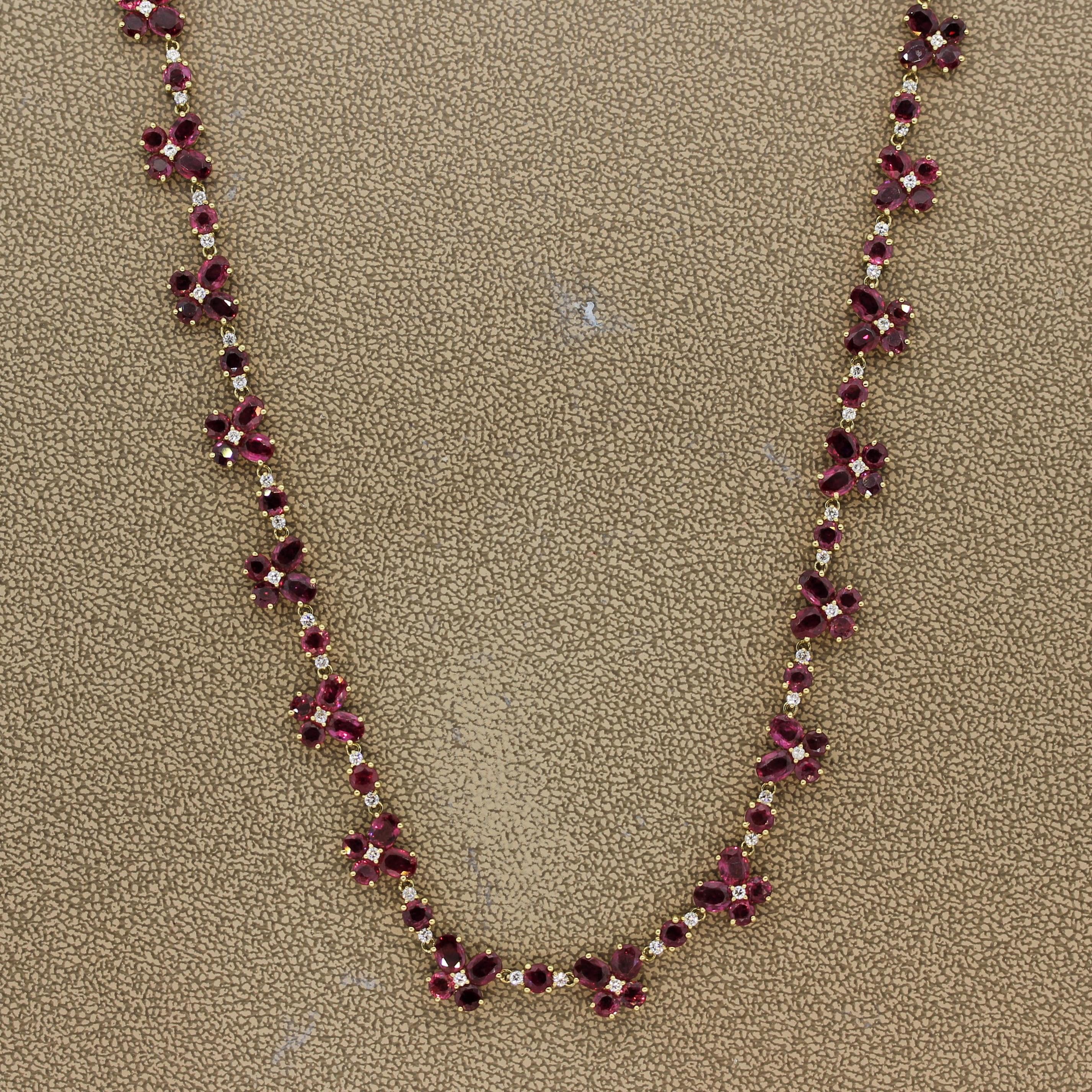 A sweet and chic ruby and diamond necklace. The piece features 44.89 carats of fine rubies in oval and round shapes along with 2.07 carats of round brilliant cut diamonds. They are set in a pattern of 2 oval and round shaped rubies each along with 1