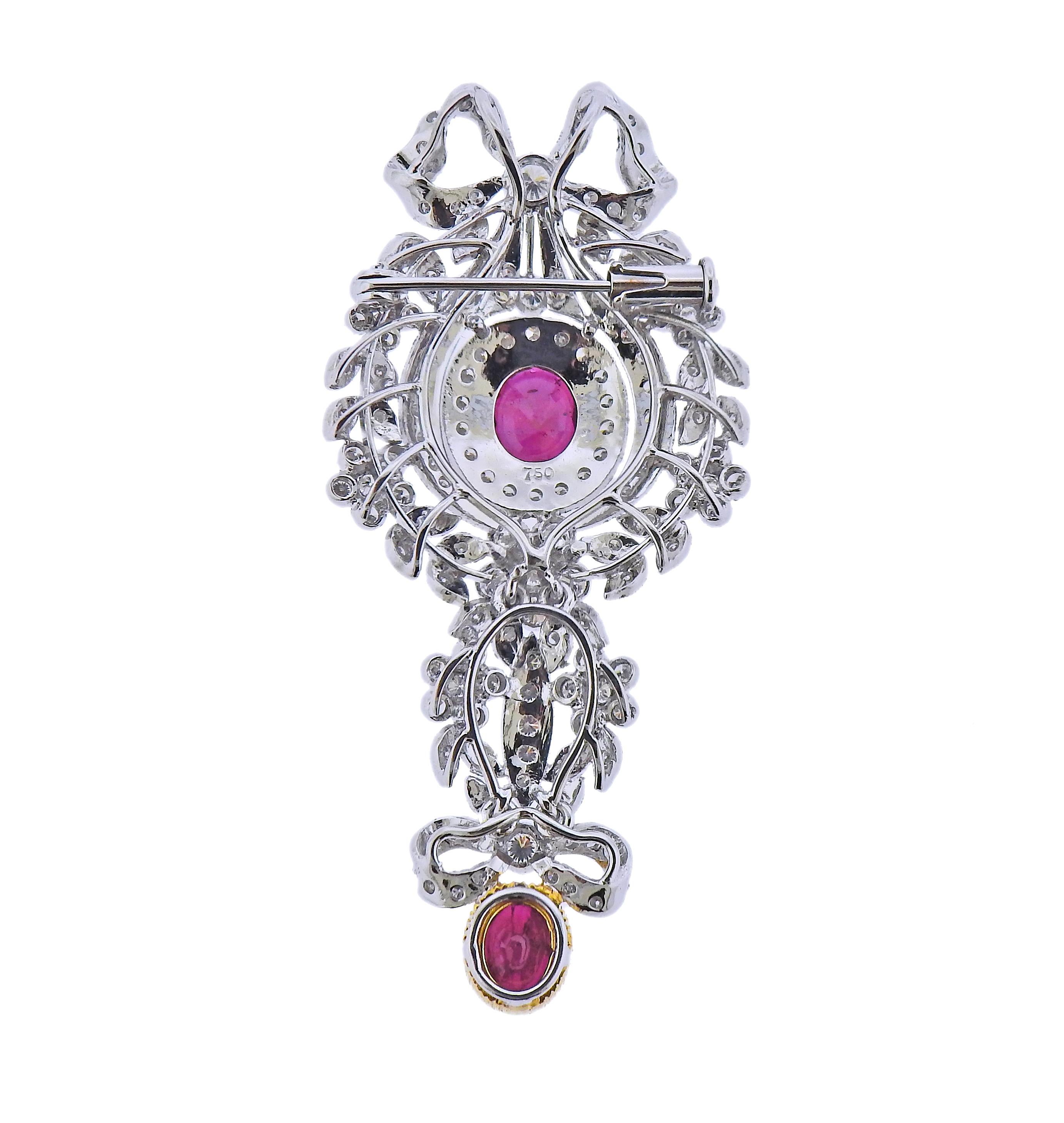 18k white and yellow gold pendant brooch, set with two rubies and apron. 0.90ctw in diamonds. Brooch is 56mm x 28mm. Marked 750. weight - 12 grams.