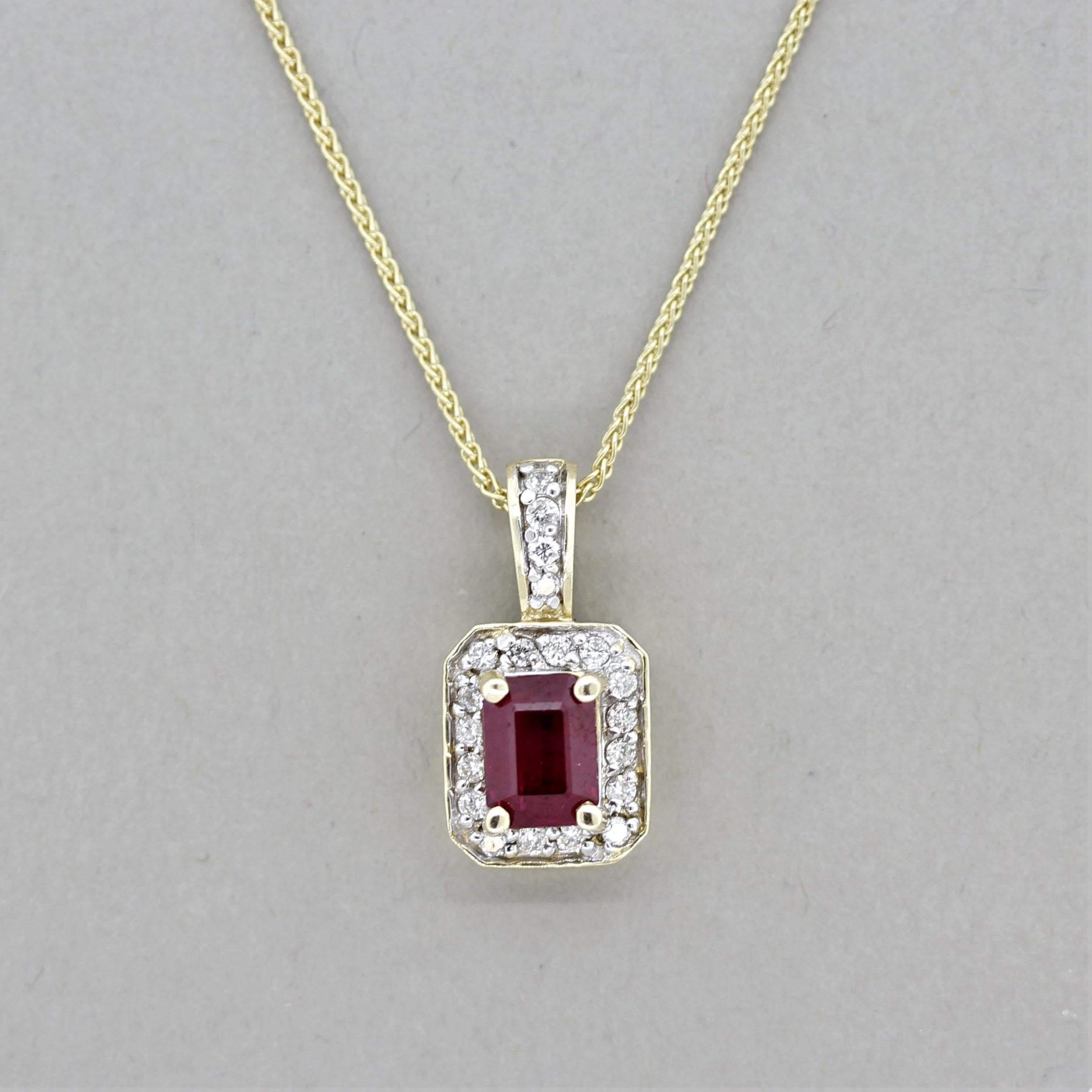 A simple yet elegant pendant featuring a 1.27 carat emerald-cut ruby. It has a classic vivid red color, also known as “pigeon’s blood” which is given to high saturated red rubies such as this example. It is accented by 0.21 carats of round
