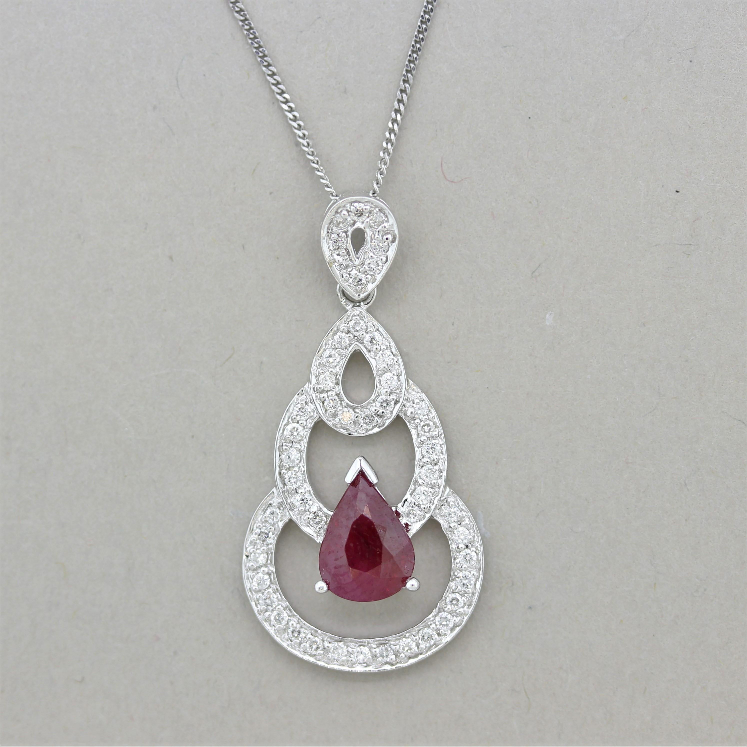 A fine pendant featuring a 1.18 carat pear-shape ruby! It has a rich vivid red color and is shaped beautifully in terms of the stones proportions and cut. It is accented by 0.29 carats of round brilliant-cut diamonds which add sparkle and brilliance