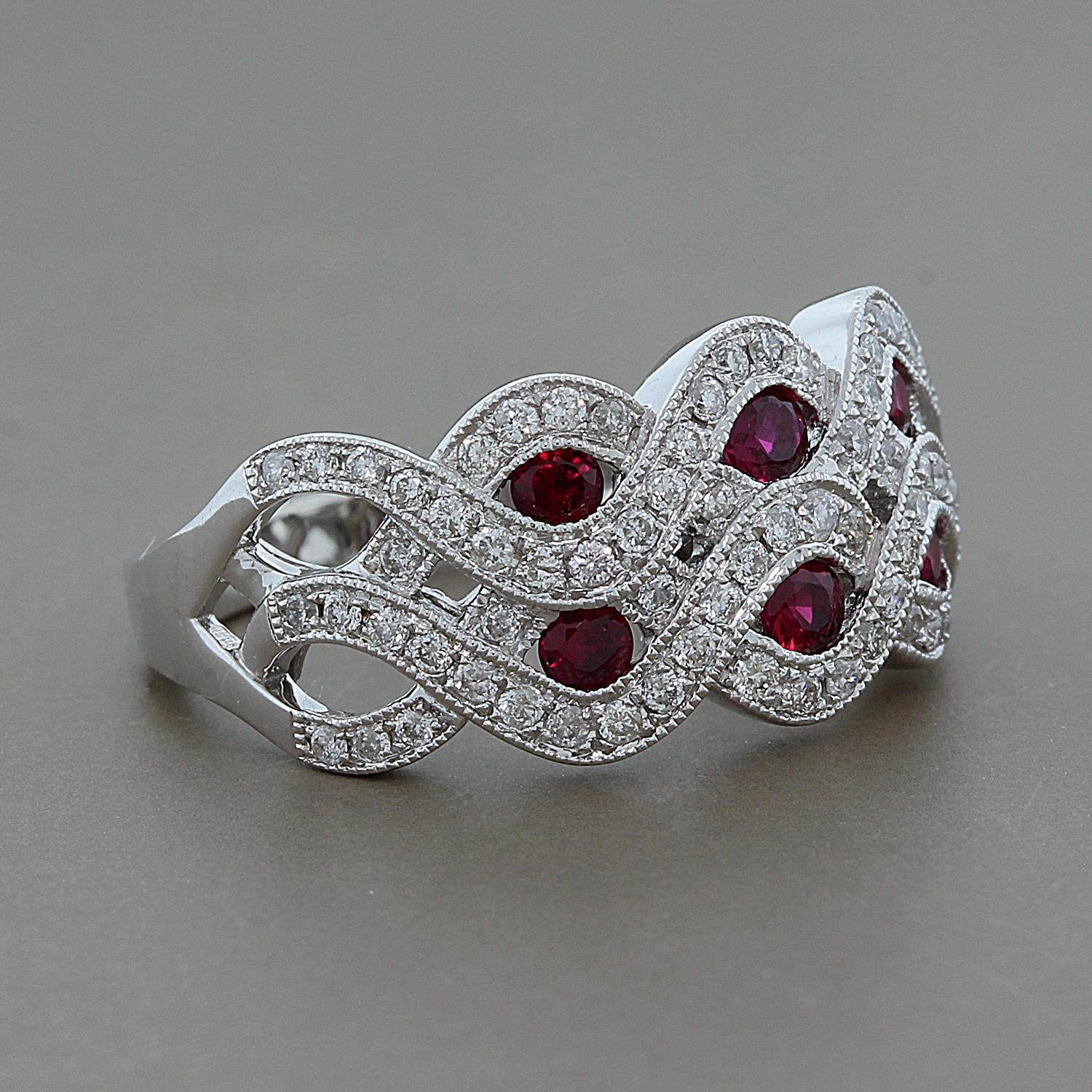 A beautifully elegant ring featuring 0.46 carats of round cut rubies surrounded by a wave of 0.50 carats of round diamonds.  All set in 14K white gold.

Currently ring size 7