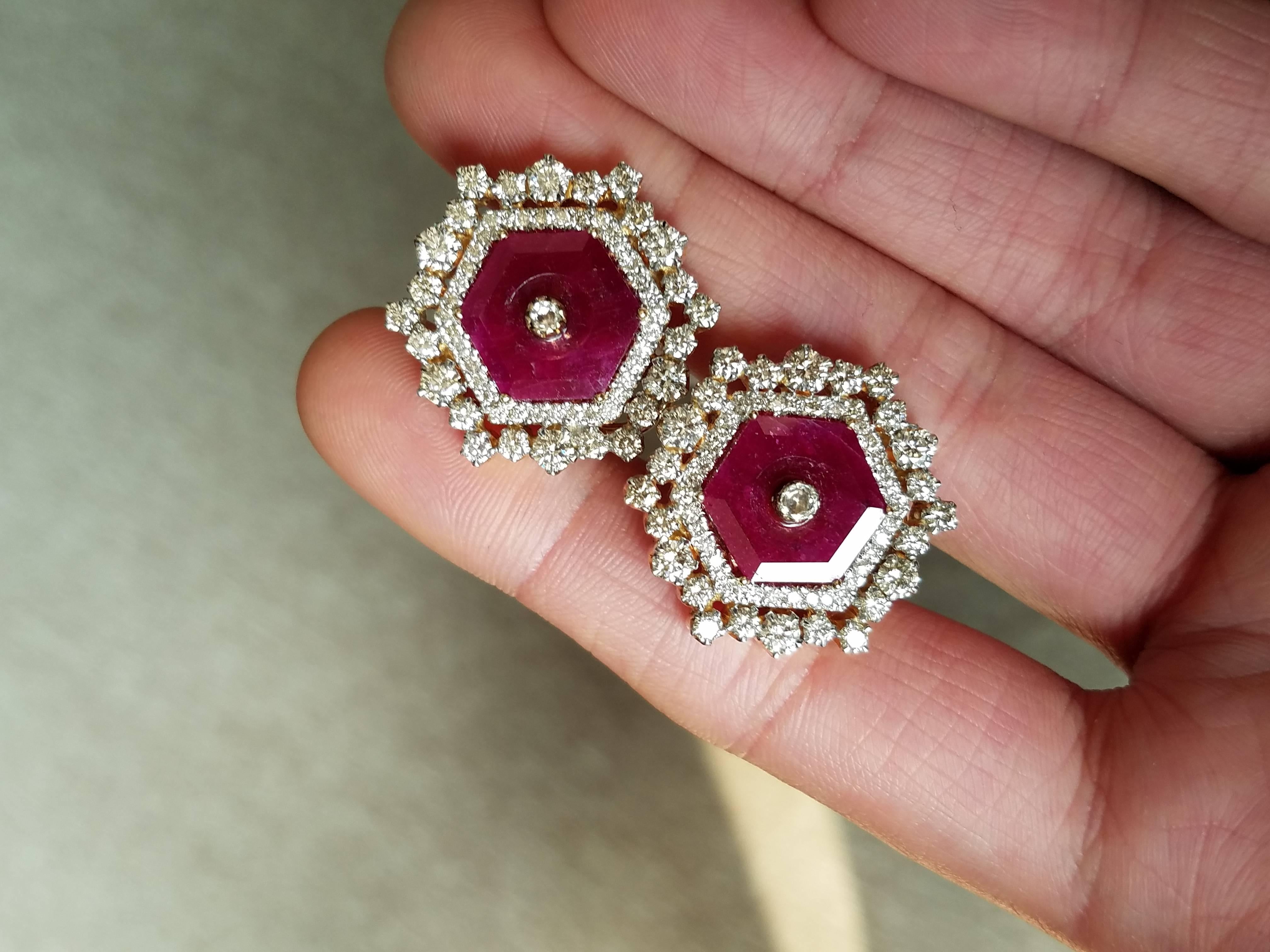 A beautiful pair of earrings, with a unique design which can be worn on many different occasions. 

Stone Details:  
Stone: Ruby
Cut: Hexagon
Carat Weight: 7.25 Carat  

Diamond Details: 
Cut: Brilliant
Total Carat Weight: 3.66 carat 
Quality: VS/SI
