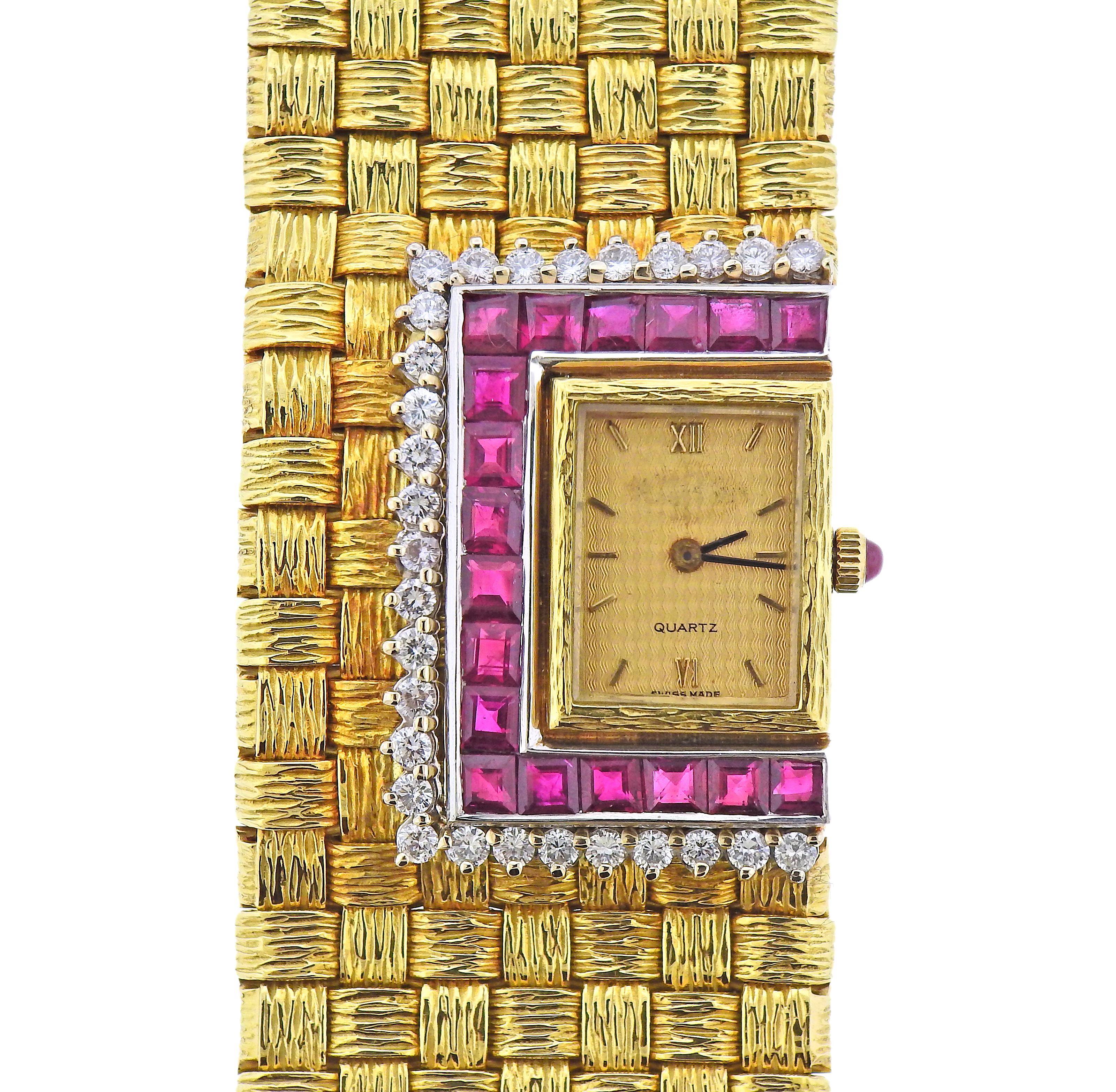 18k yellow gold woven bracelet watch, decorated with rubies and approx. 1.16ctw in diamonds. Bracelet is 7.25