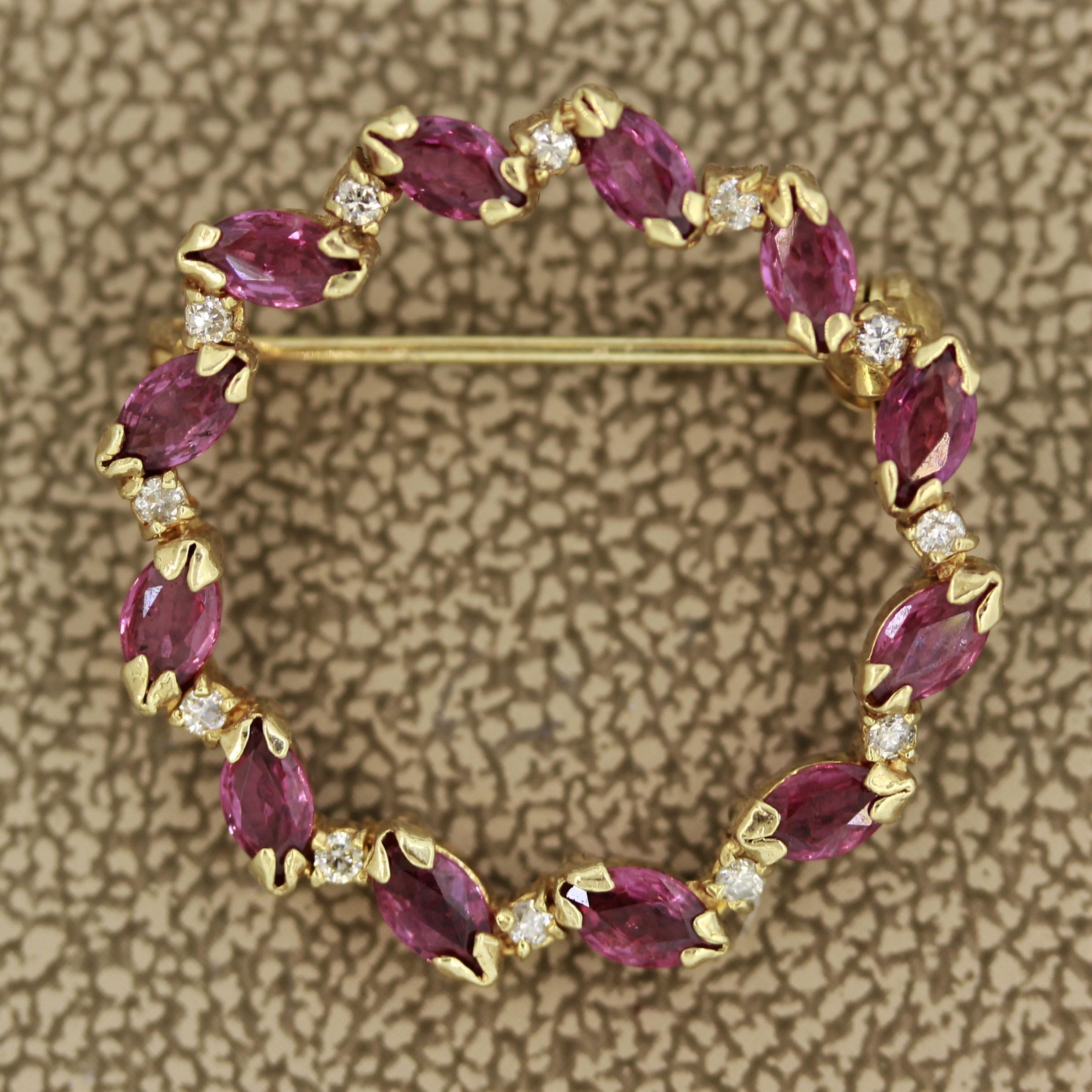 A simple yet detailed circle brooch featuring approximately 1.50 carats of marquise shaped rubies and round cut diamonds. Set in 14k yellow gold, this light weight brooch can be worn with any outfit.