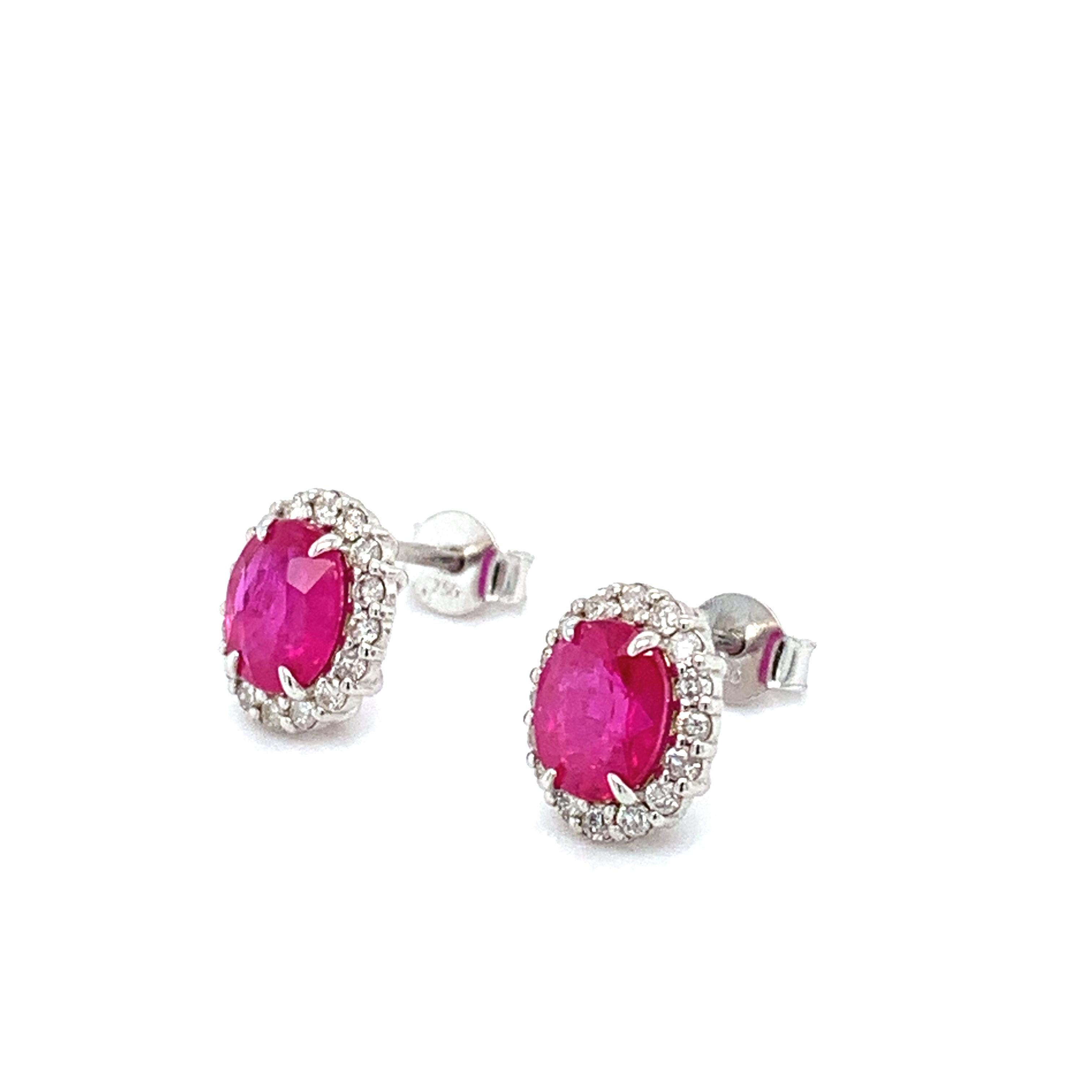 1.20ct Ruby diamond halo art deco studs earrings in 18k white gold.
Consisting of oval shaped natural ruby gemstone surrounded by round brilliant cut diamonds studs earrings 18k white gold
Ruby oval shaped total weight 0.80ct 
Diamonds total weight