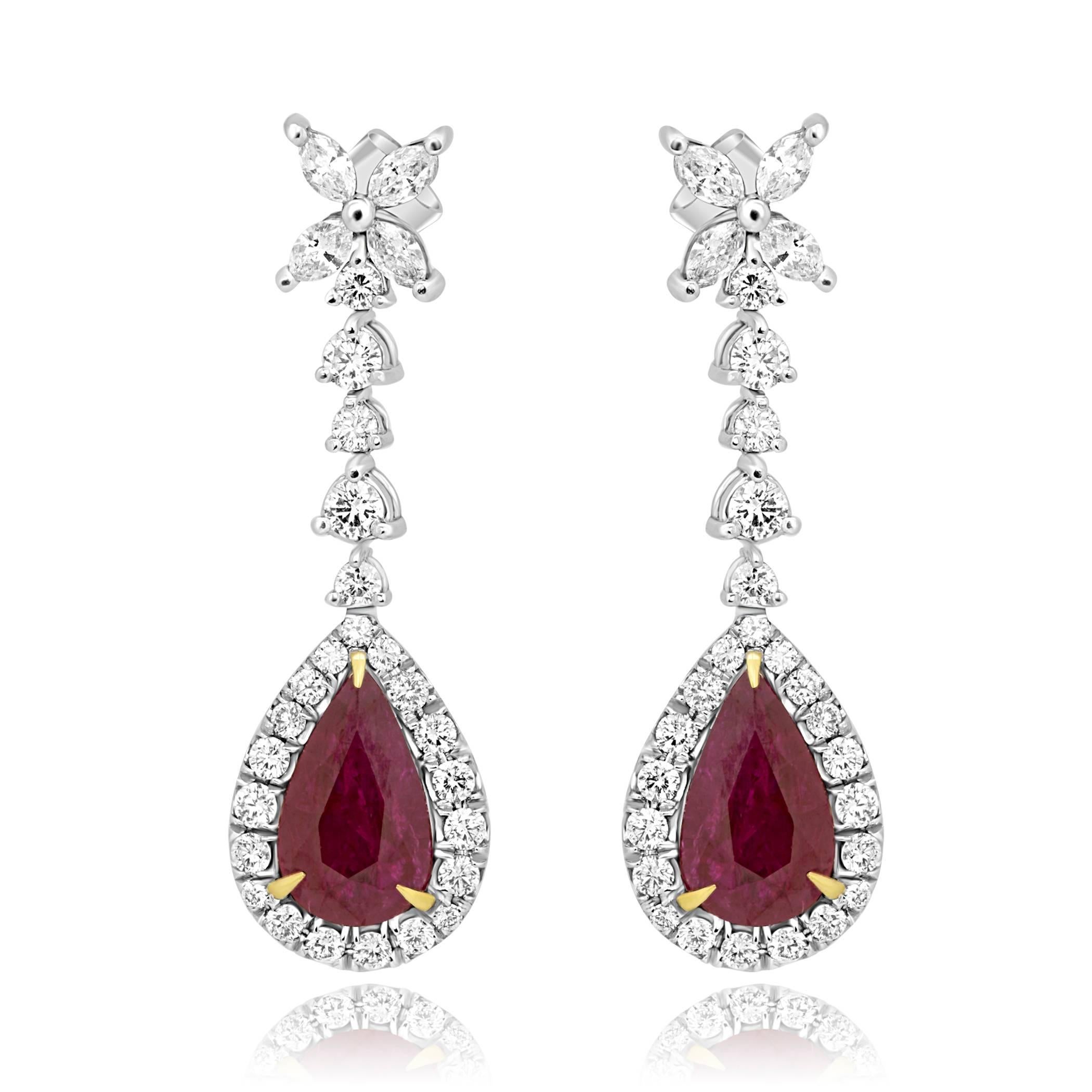 Stunning 2 Pear Shape Ruby 5.29 Carat encircled in a single Halo of white round diamonds 1.26 Carat with 8 White Marquise Diamond on top 0.68 Carat in 18K White Gold Earring.

Style available in different price ranges. Prices are based on your