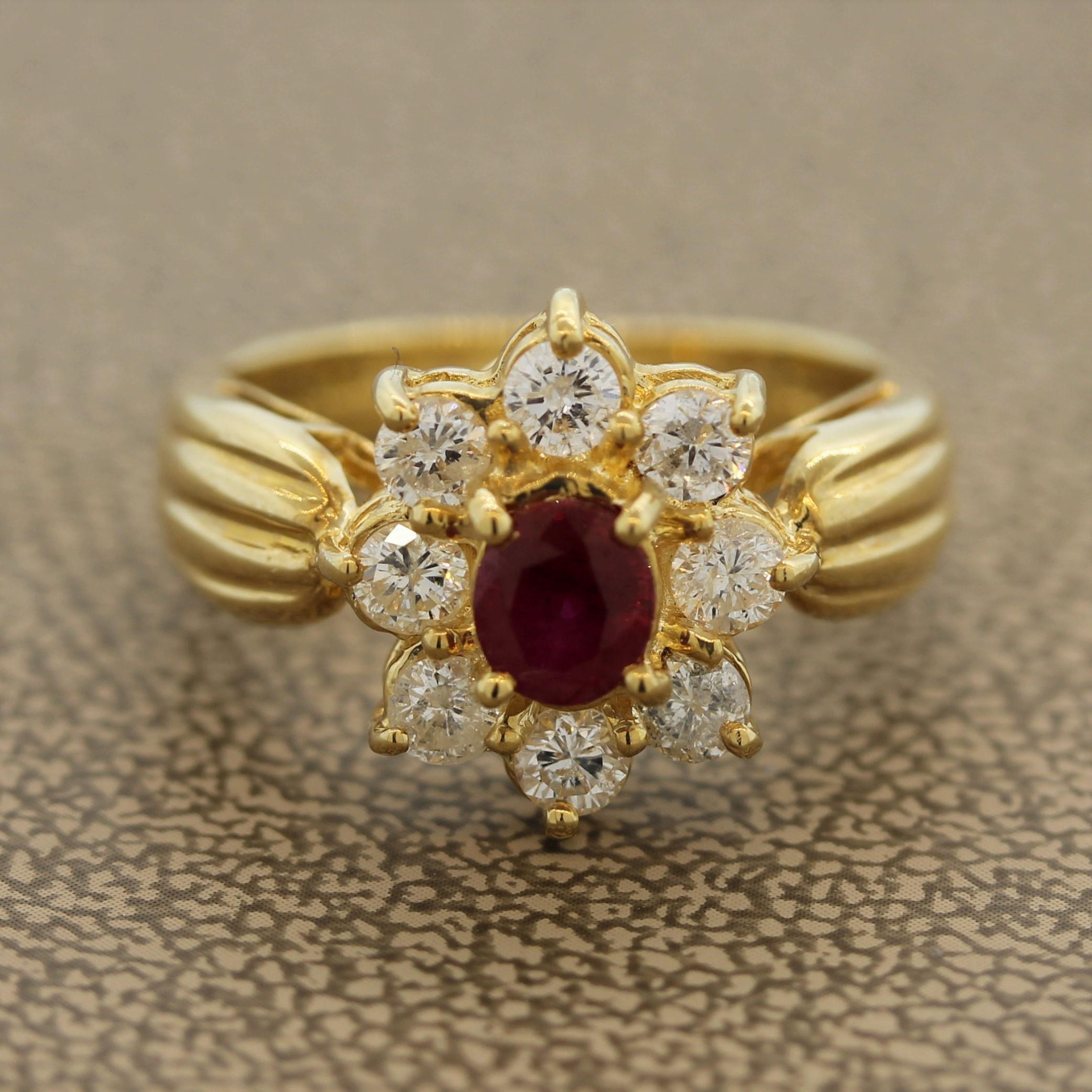 Une bague simple et élégante, ornée d'un rubis ovale de 0,65 carat. Le rubis, d'une belle couleur rouge vif, est entouré d'un halo de 0,85 carats de diamants ronds de taille brillant qui forment un motif de fleur. Fabriqué en or jaune 18k.

Taille