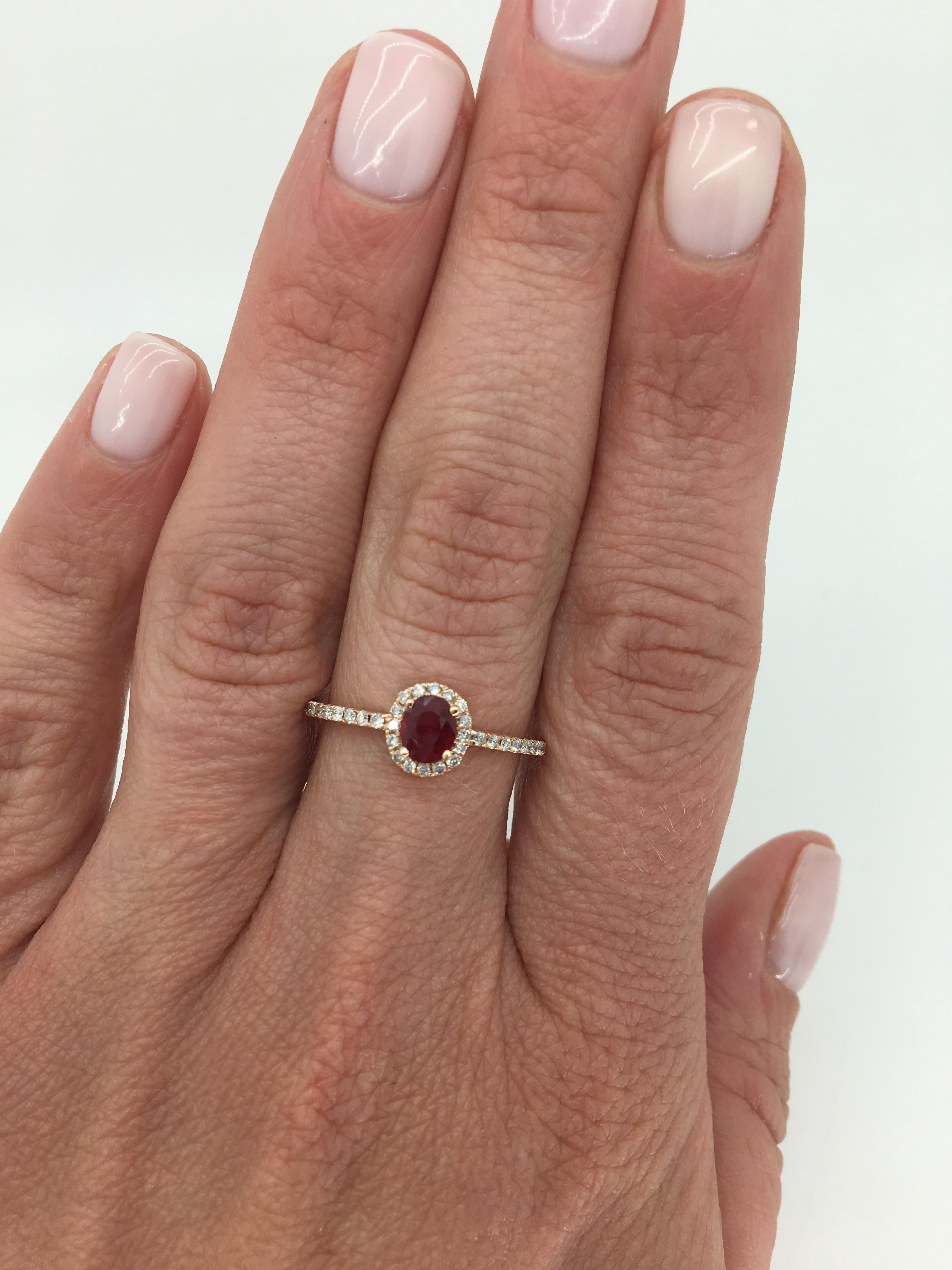 Oval Cut Ruby and diamond ring crafted in 14K rose gold. 

Gemstone: Ruby and Diamond
Gemstone Carat Weight: Approximately .35CT Oval Cut
Diamond Carat Weight: Approximately .23CTW
Diamond Cut: Round Brilliant Cut
Color: Average H-J
Clarity: Average
