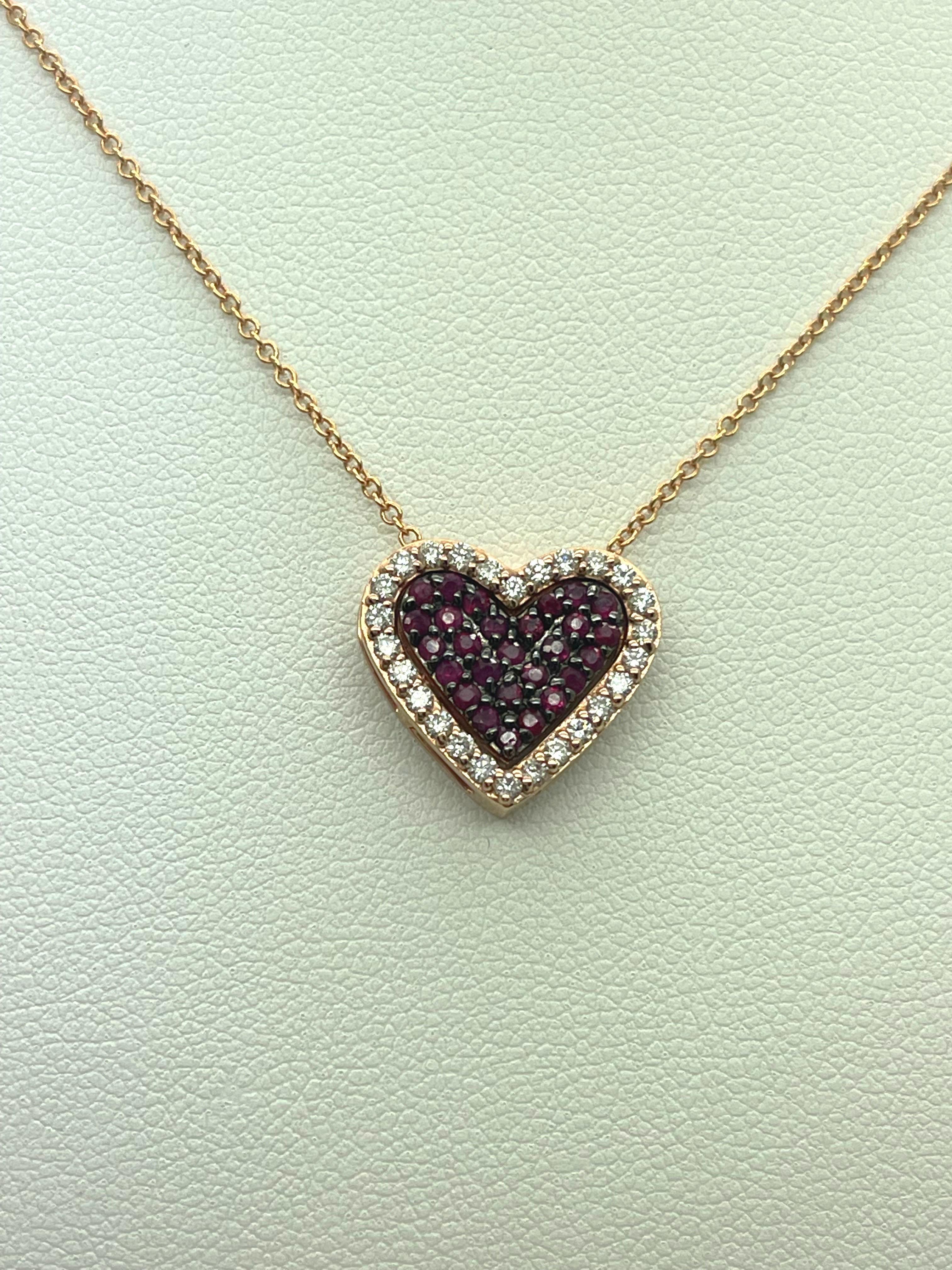 Elegant Ruby & Diamond Heart necklace In 14k Rose Gold.

- 0.38 carat in Rubies,

- 0.32 carats in diamonds,

- 18” long.