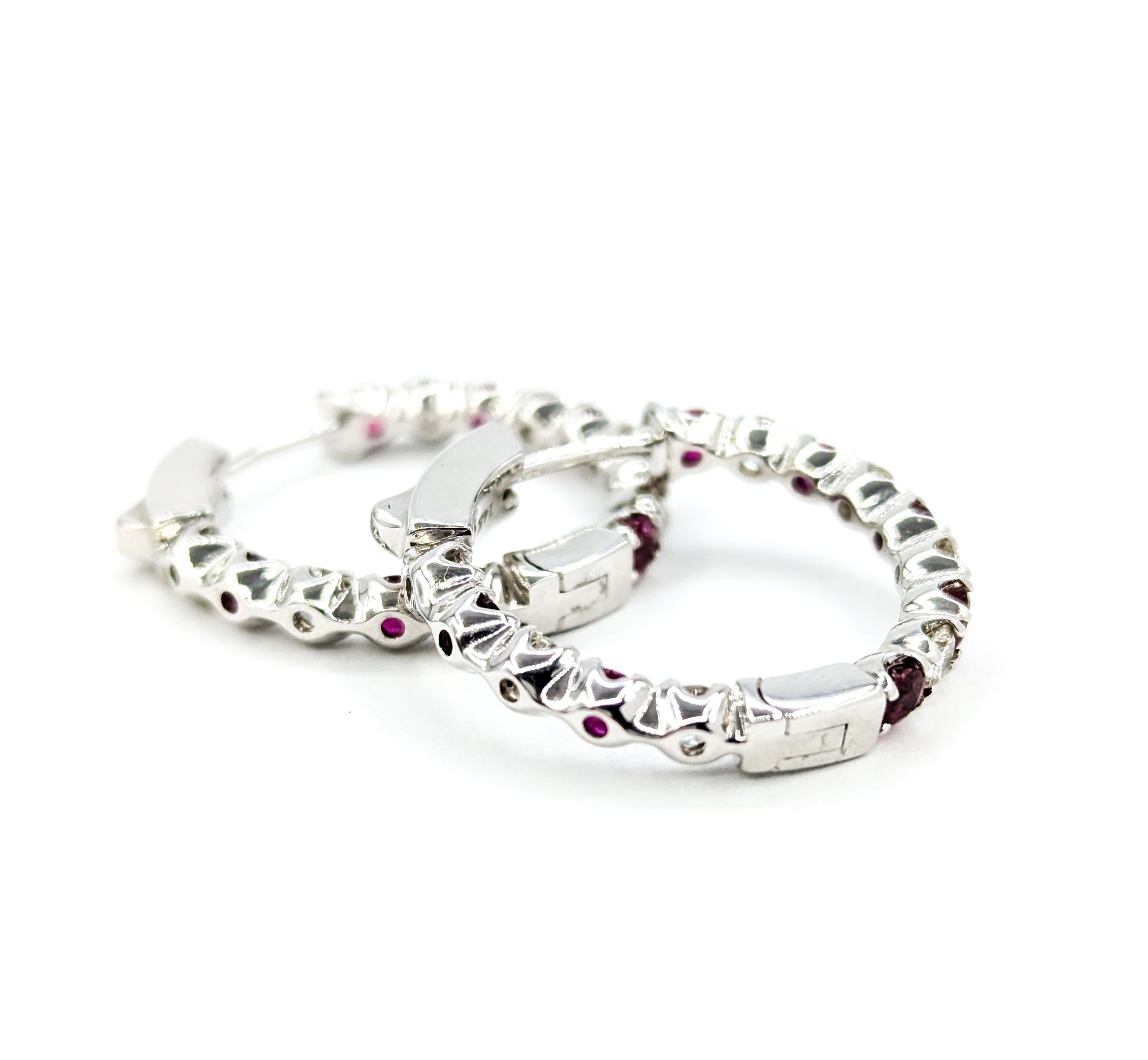 Ruby & Diamond Hoop Earrings in White Gold

These exquisite Ruby & Diamond earrings are beautifully crafted in 14k white gold.  The hoops feature 1.38ctw in rubies, the true stars of this piece. Rubies, the birthstone for July, are known for their