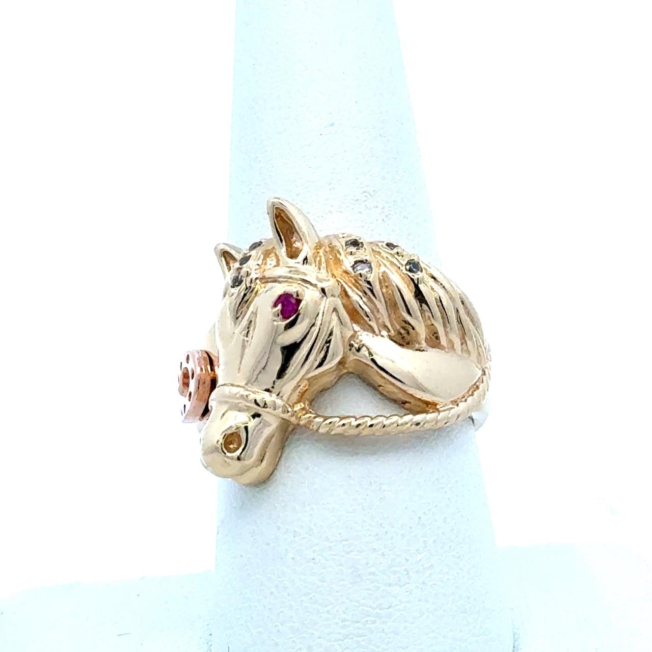 This Beautiful Vintage Horse Ring dates from The 1960's.
It Features a Decorative Rose Gold Horseshoe on The Ring's Side.
8 Brilliant High Quality Round Diamonds along The Horse’s Mane.
1 Beautiful Ruby for The Eye.
The Ring is a Size 9.25 and Can