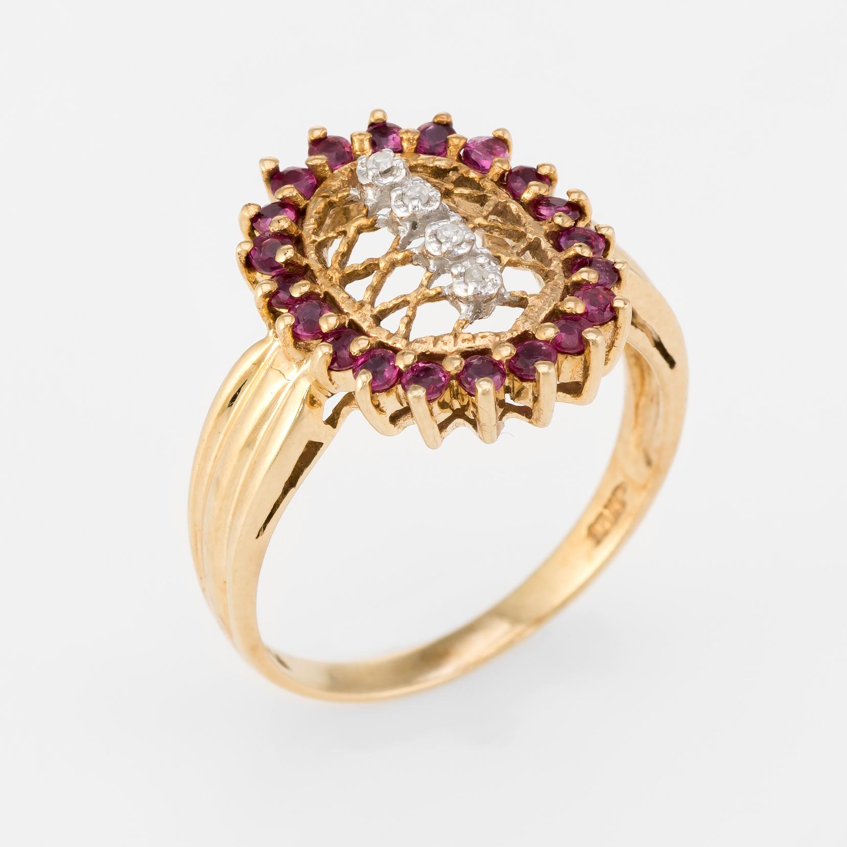 Elegant vintage cocktail ring, crafted in 10 karat yellow gold. 

20 rubies total an estimated 0.50 carats, accented with an estimated 0.04 carats of diamonds (estimated at I color and I2 clarity).    

The ring is in excellent condition.