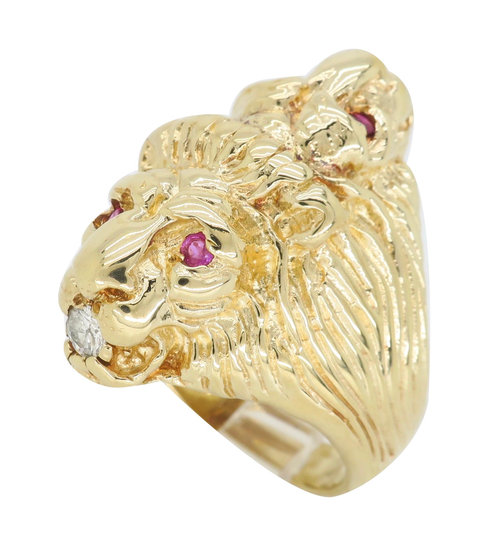 Unique vintage double headed lion ring with diamonds and rubies crafted in 14k yellow gold.

Gemstone: Diamonds and Rubies
Gemstone Carat Weight: 4 Approximately 2mm Rubies 
Diamond Cut: 2 Round Brilliant Cut 
Average Diamond Color: G-I
Average