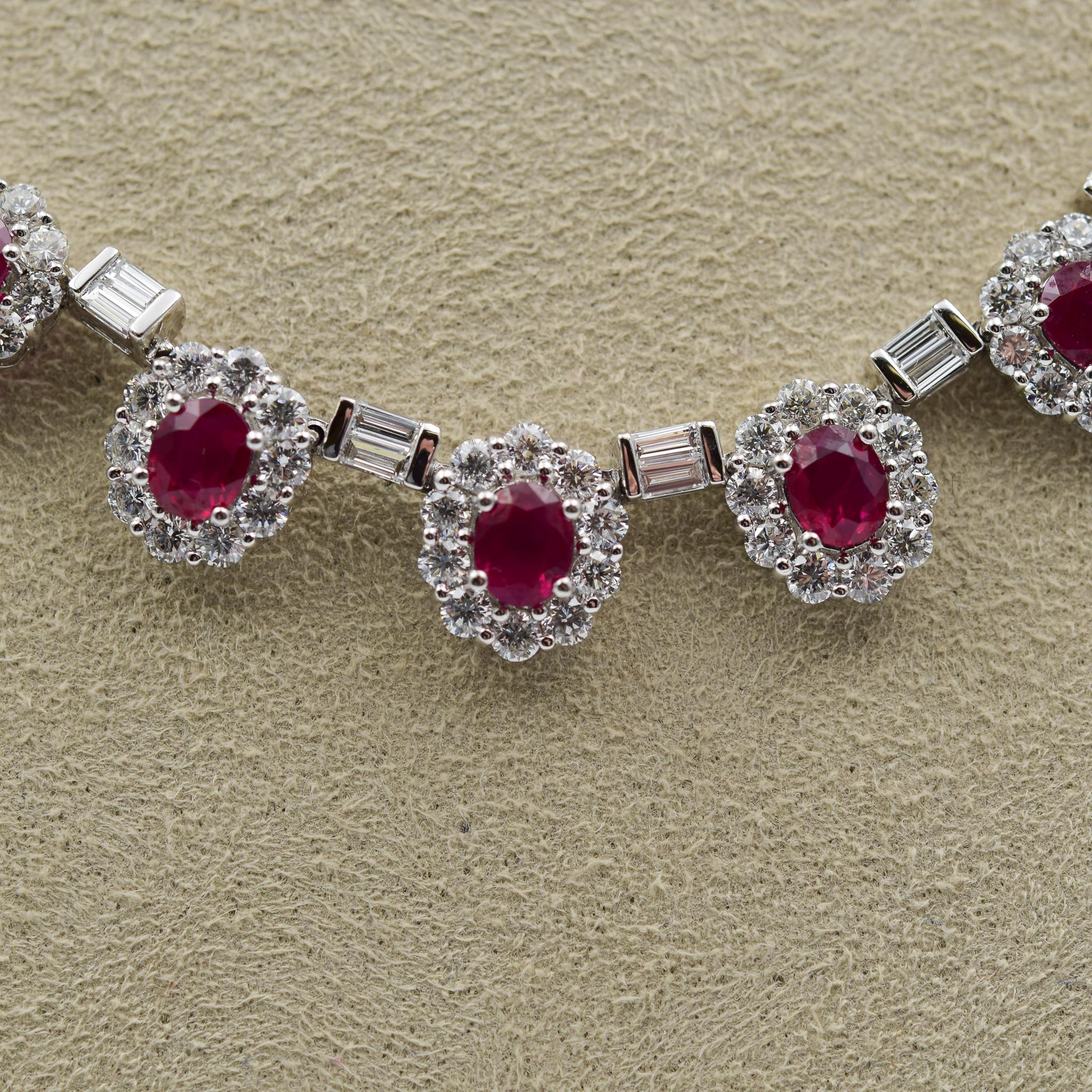 This immaculate ruby and diamond necklace was recently sold to the store as an estate piece.  The rubies are all a very fine red similar to a Burmese red ruby and each one has a diamond-set halo accenting the stone.  Between each of the halo