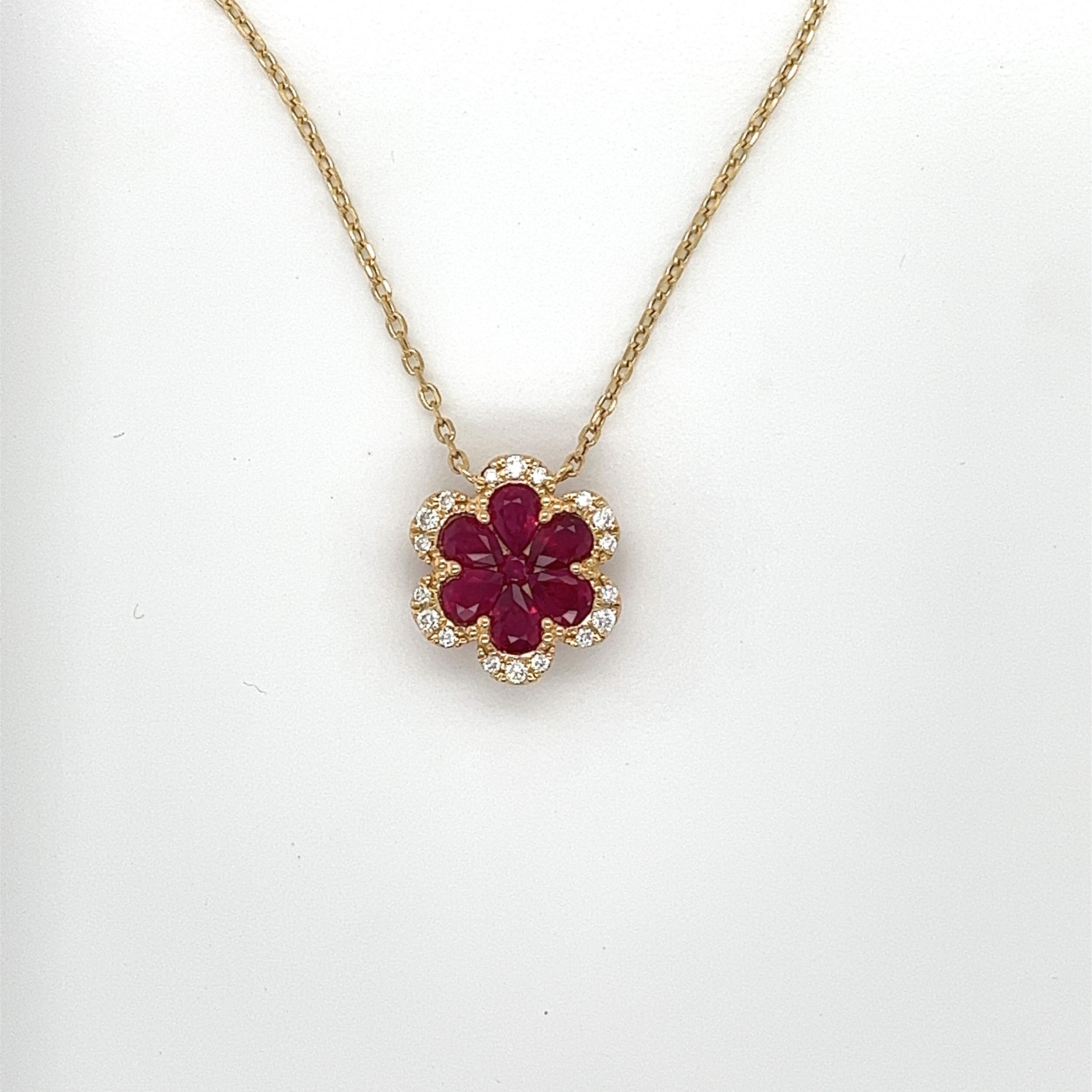 6 pear shape rubies weighing 1.06 cts
1 round ruby weighing .04 cts
18 round diamonds weighing .13 cts
H-SI
Set in 18k yellow gold
2.63 g
Adjustable 16-18 in yellow gold chain