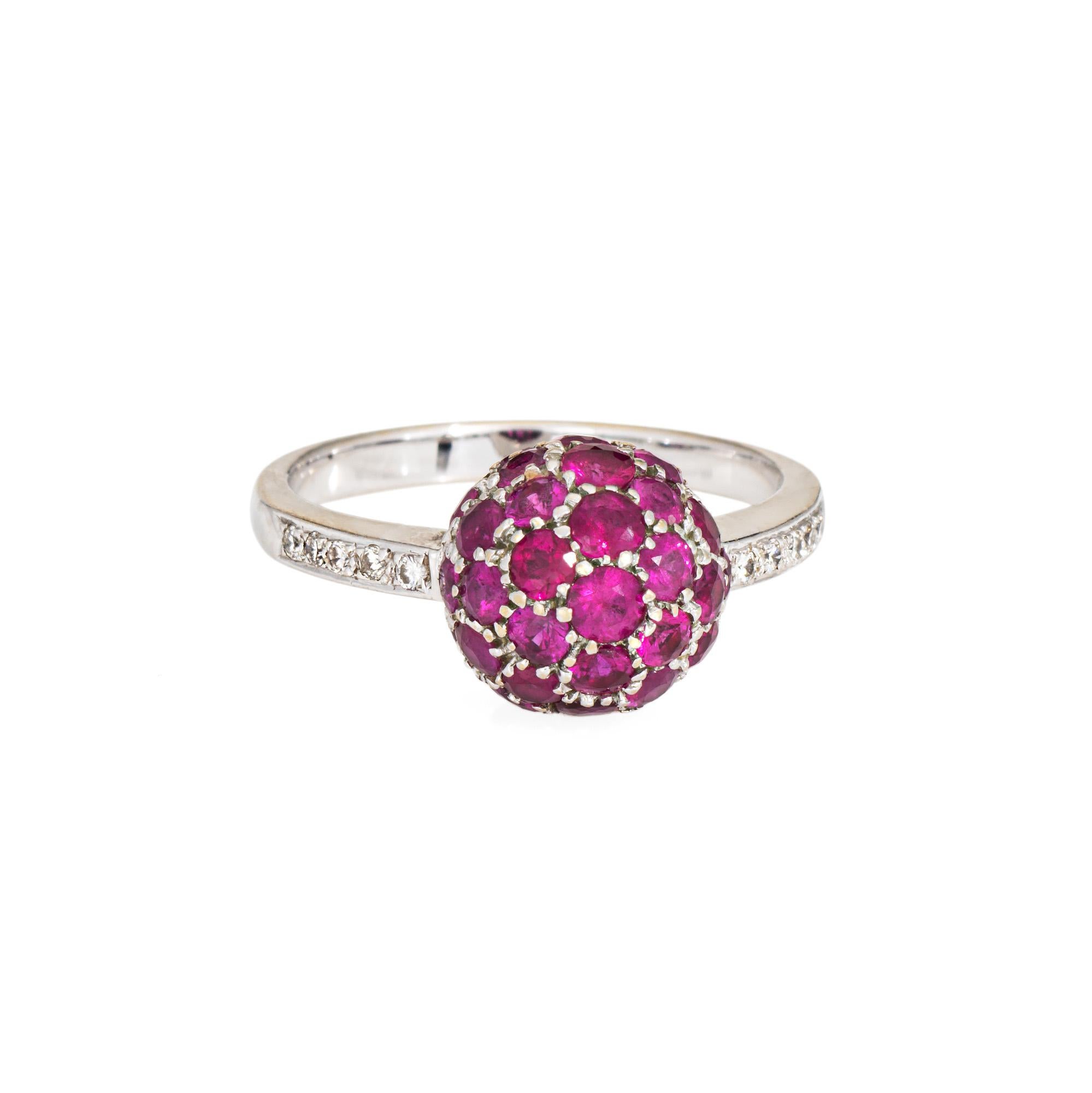 Stylish ruby & diamond orb ring crafted in 18 karat white gold (circa 2000s). 

Rubies measure from approx. 1.5mm to 2mm. Diamonds total an estimated 0.05 carats (estimated at H-I color and SI1-I1 clarity).  

Pave rubies are set into an orb design
