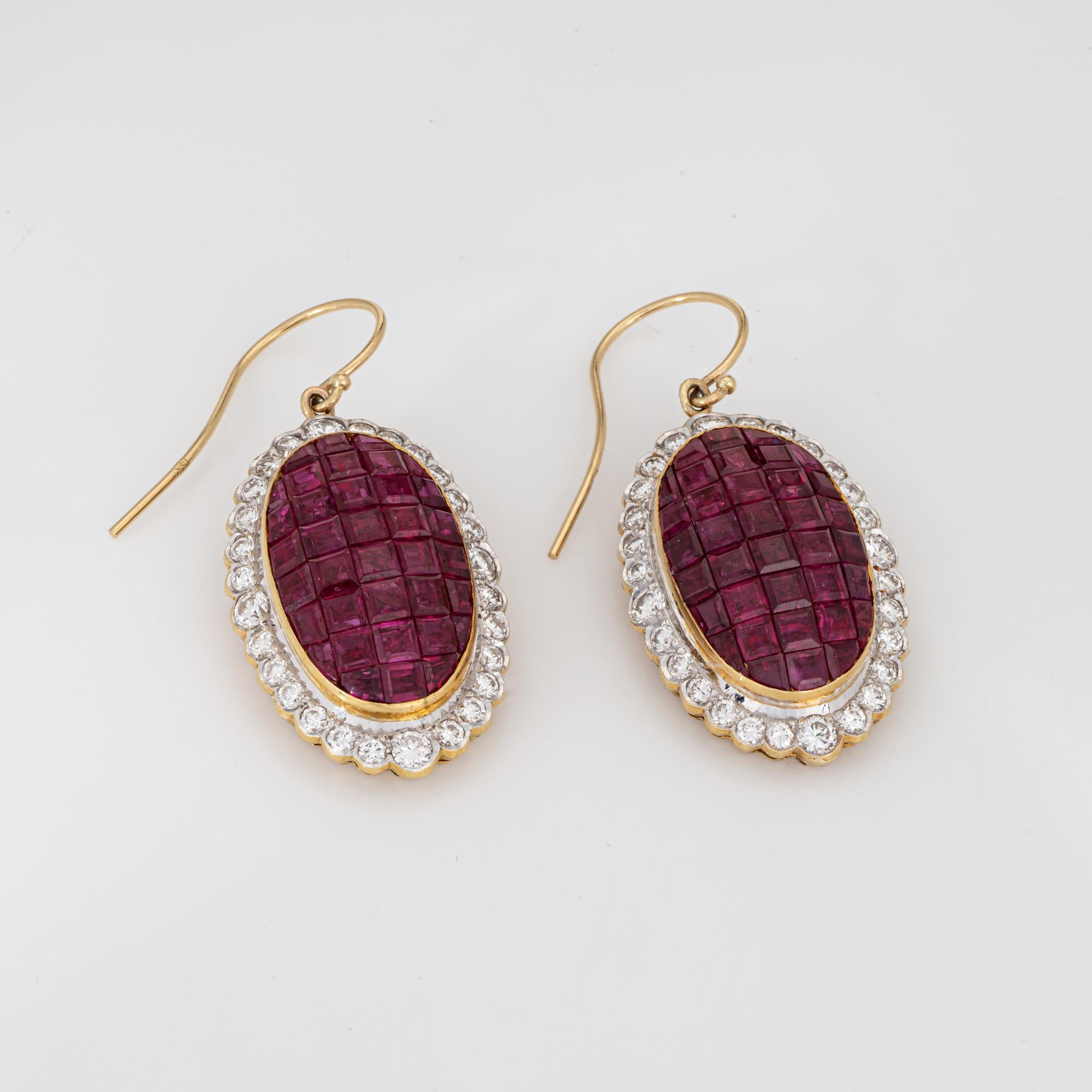 Elegant pair of diamond & ruby pendant drop earrings crafted in 18k yellow gold. 

Round brilliant diamonds total an estimated 1.10 carats (estimated at H-I color and VS2-SI2 clarity). Calibre cut rubies range in size from 1.5mm to 2.5mm. The rubies