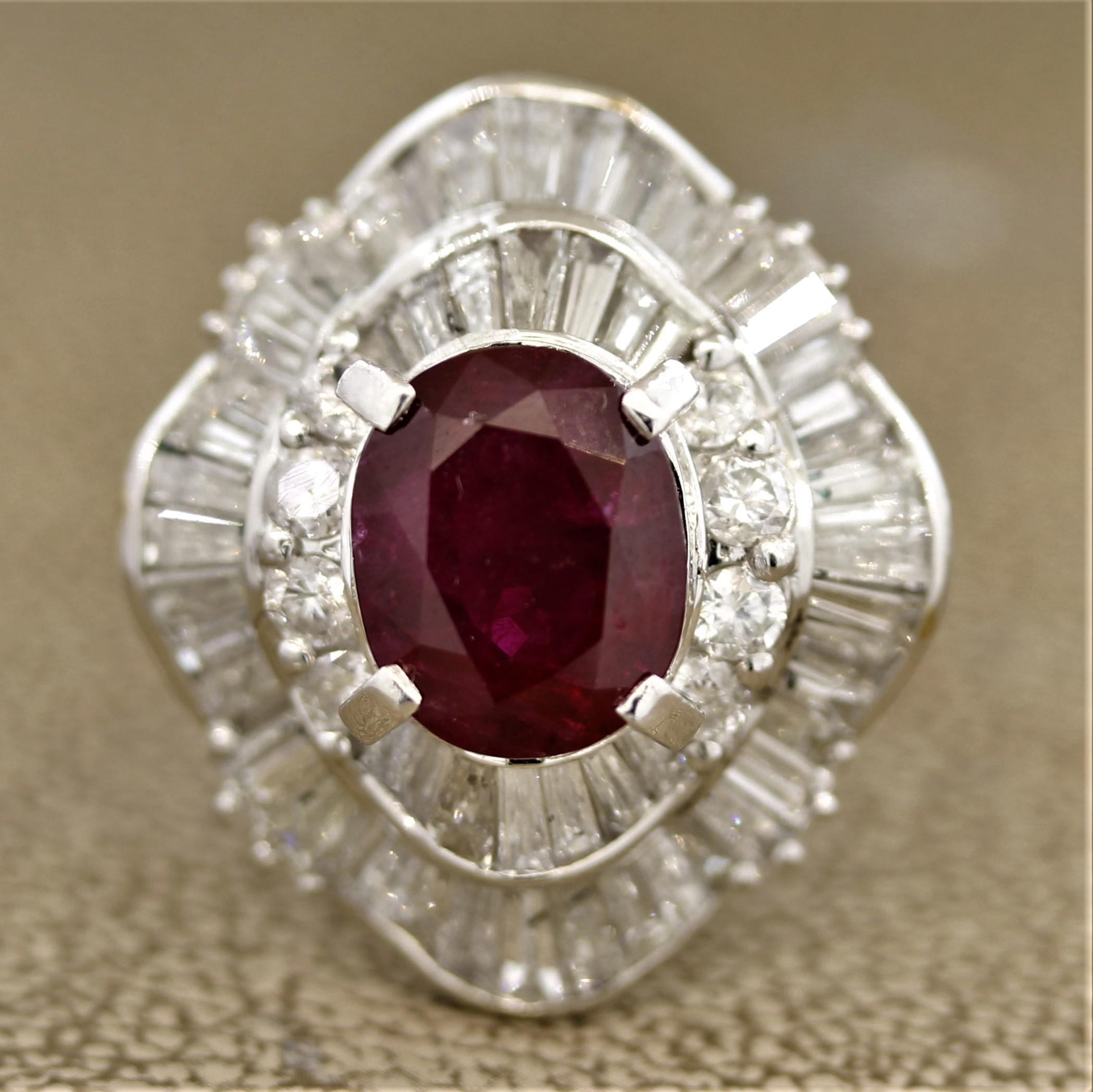 A wow piece! This large cocktail ring features a 3.58 carat ruby with a deep royal red color and is cut as an oval shape. It is accented by 3.05 carats of round brilliant and baguette cut diamonds set around the ruby in a stylish pattern.