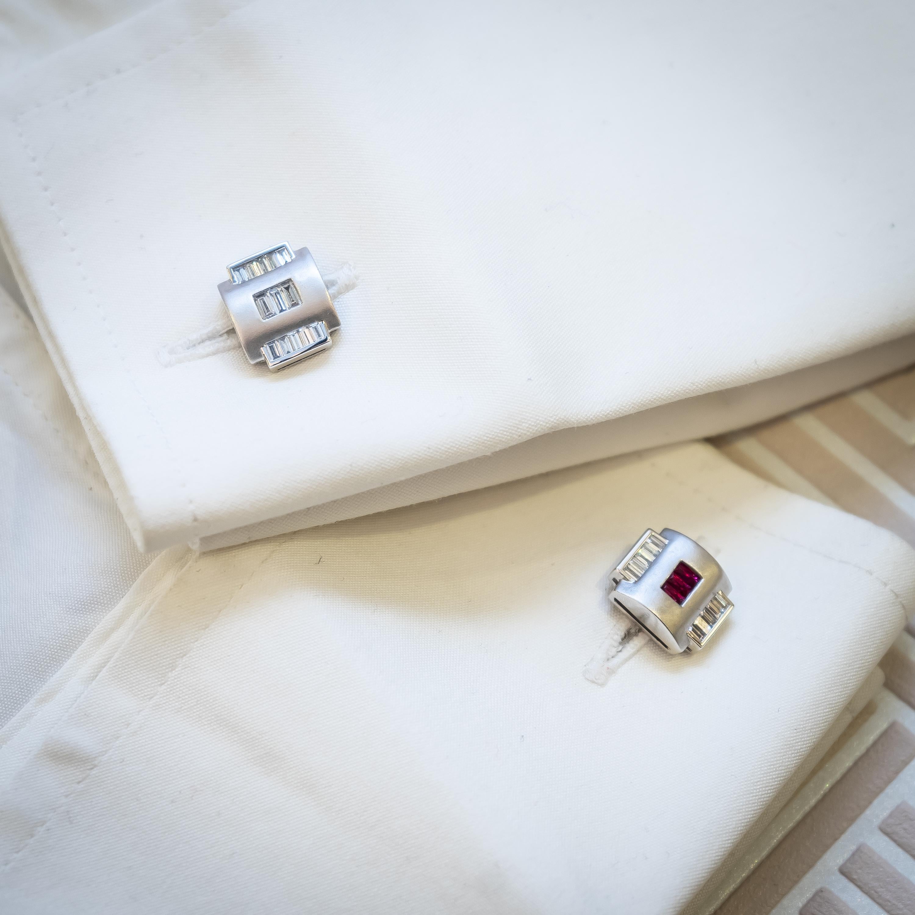 Platinum cufflinks set with baguette-cut diamonds and French-cut rubies.