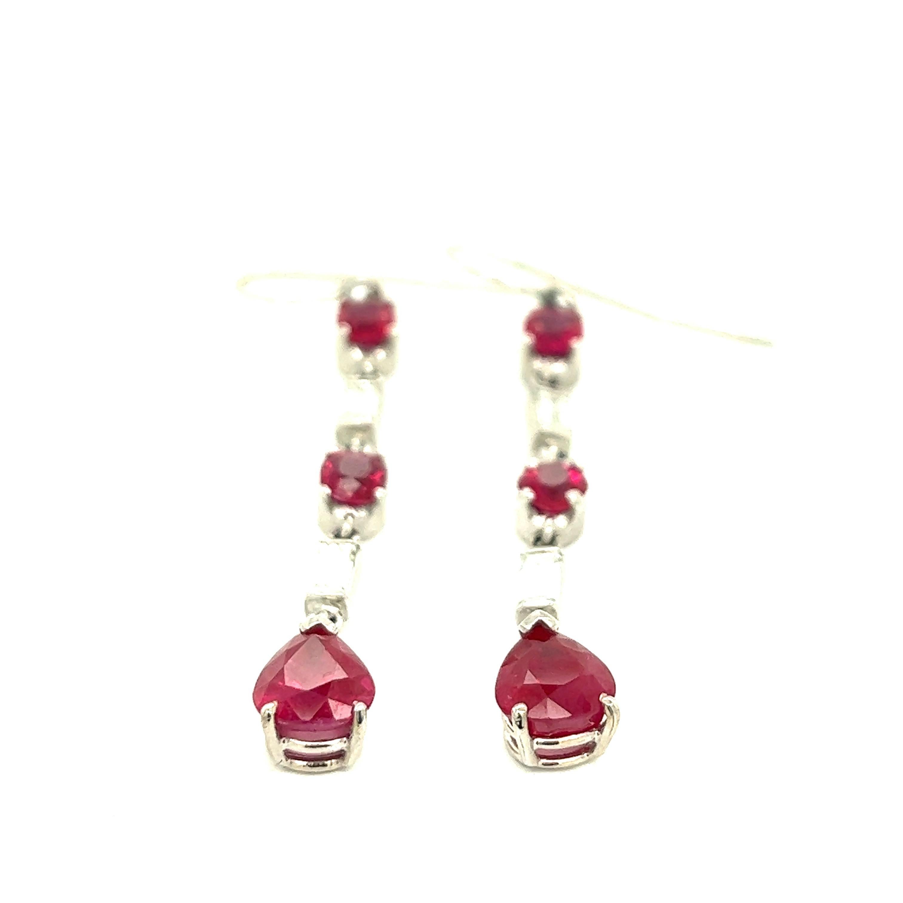 Ruby from Burma,Diamond Platinum Dangling Hook Earrings 

Pear-shape (6.9 x 8 mm) and round-cut rubies of approximately 4 carats total, baguette diamonds of approximately 0.80 carat total, set on platinum metal; fish hooks style

Size: length 5.1