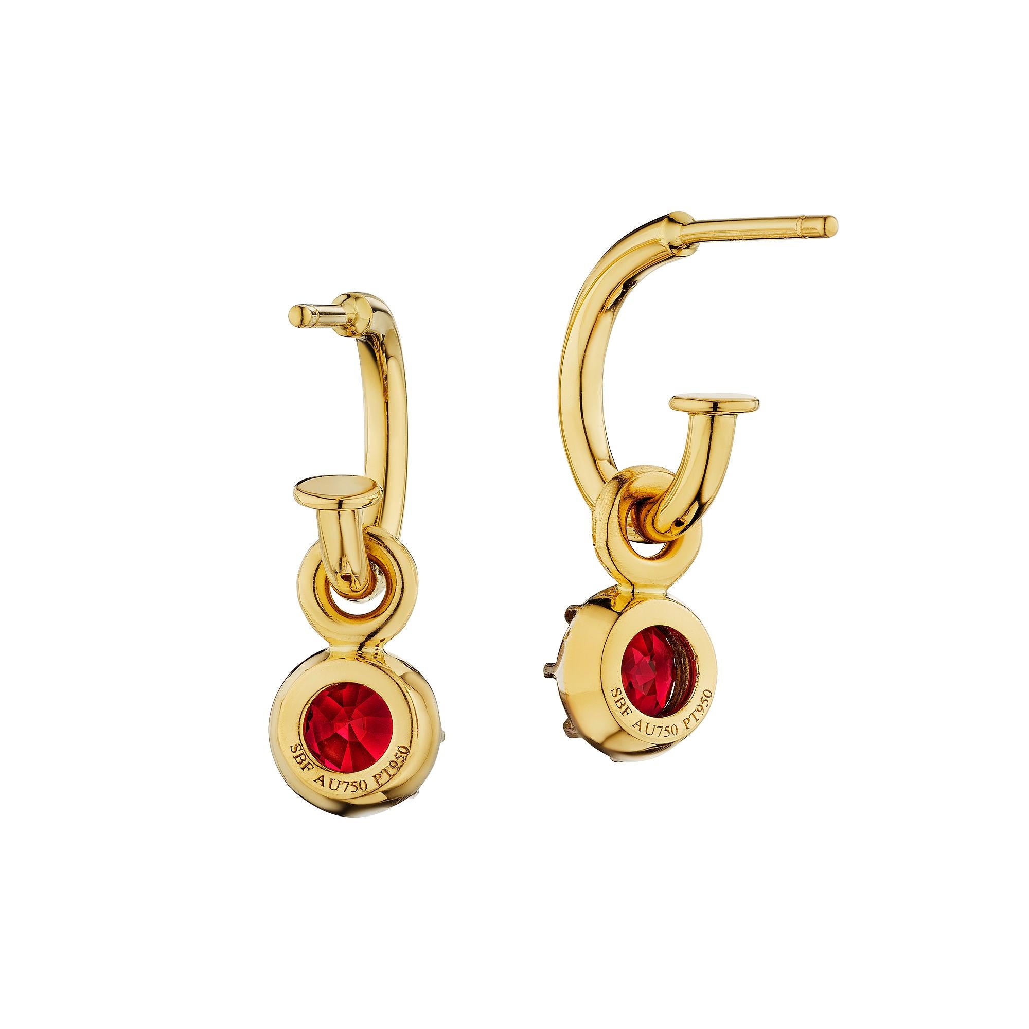 Easy does it.  With a casual personality, these handmade ruby, diamond, platinum, and 18 karat yellow gold drop hoop earrings will be the treasured accessory you never take off.  Total weight of the two round cut drop rubies is 1.43 carats.   Side
