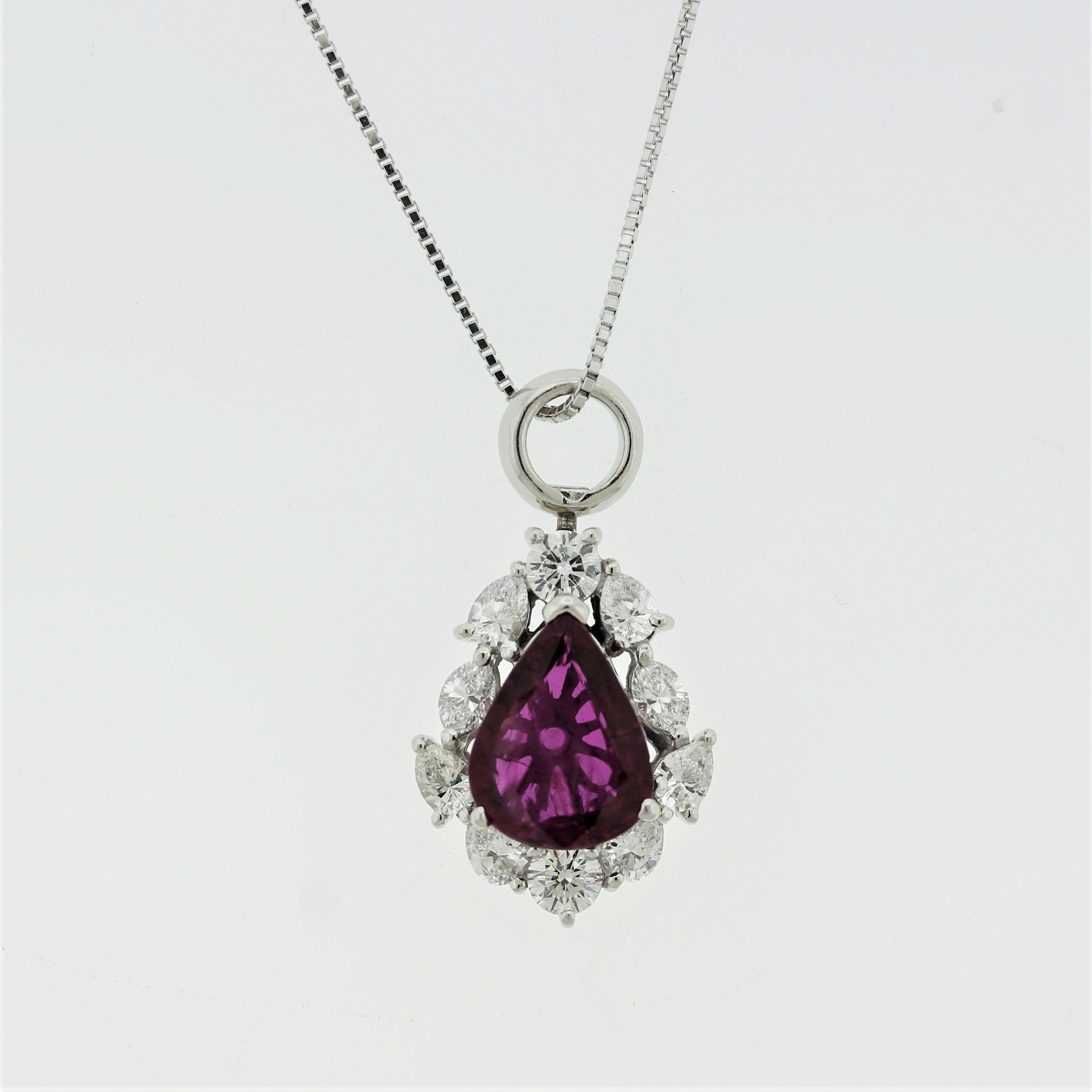 A fine pear-shape ruby takes center stage of this classy platinum pendant. It weighs 2.05 carats and has a rich intense vivid red color with excellent light and brilliance. It is accented by 0.94 carats of large round brilliant, pear, and marquise