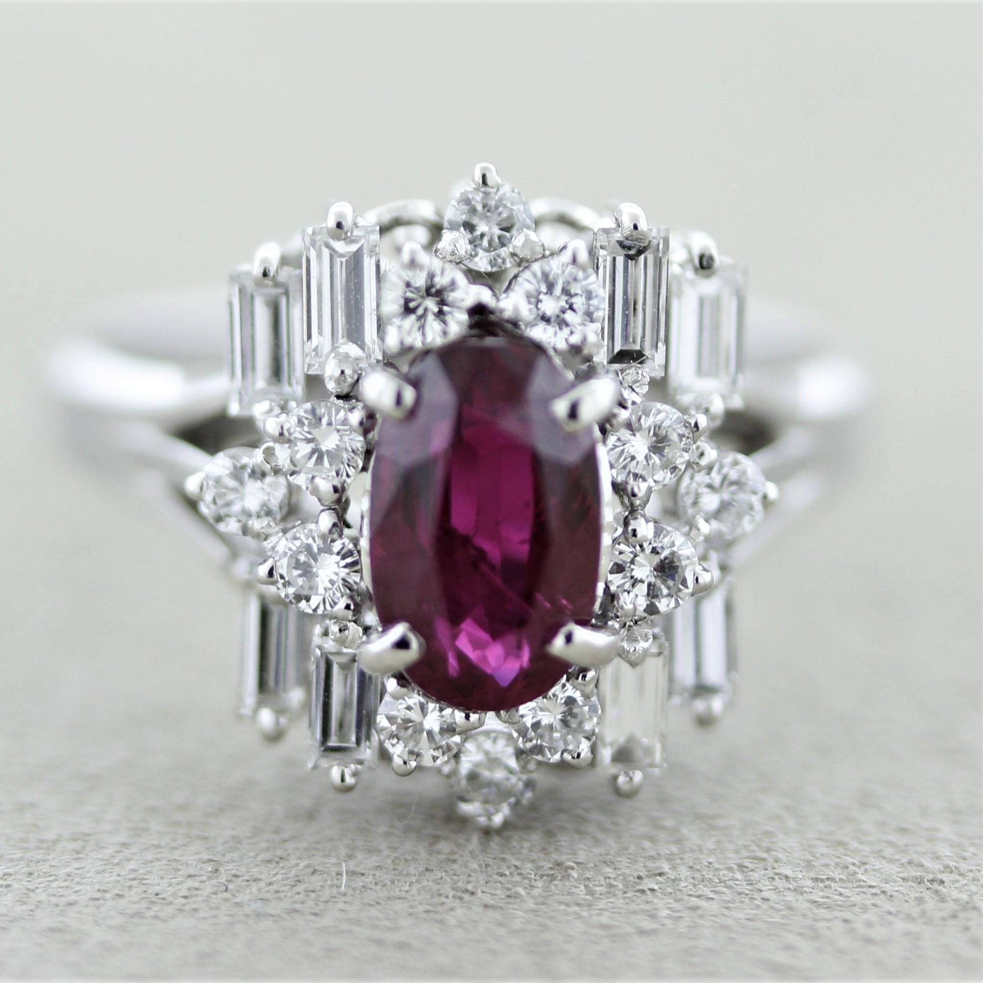 A stylish ring featuring fine gems. The oval-shape ruby weighs 1.55 carats and has a great rich royal red color. It is complemented by 0.88 carats of round brilliant and large baguette-cut diamonds set around the ruby in a unique geometric pattern.