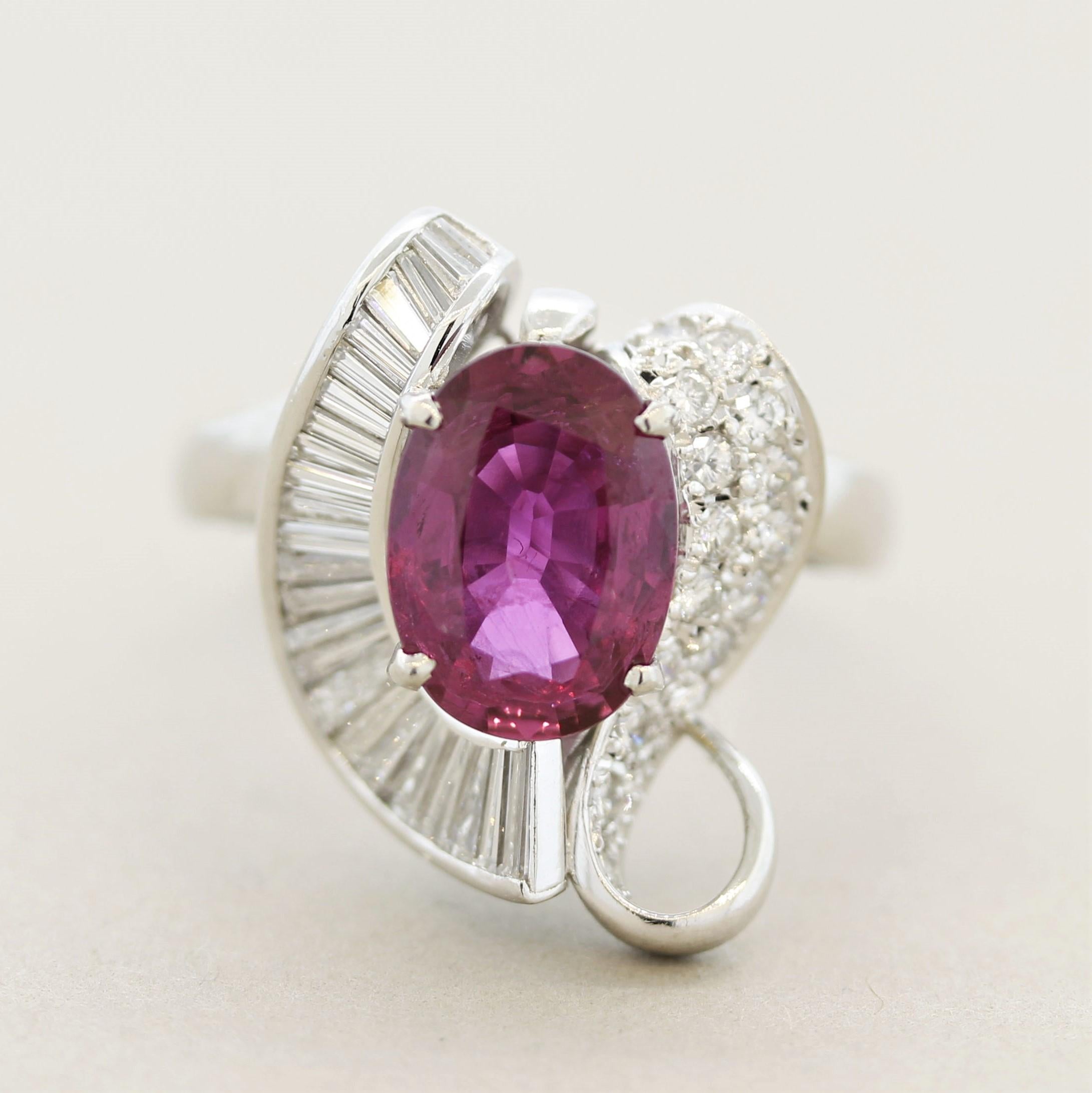 A fine platinum ring featuring a 2.99 carat oval-shape ruby! It has a vivid pinkish-purplish-red color and is certified by the GIA as natural. It is accented by 0.74 carats of round brilliant-cut diamonds pave-set on one side of the ring and