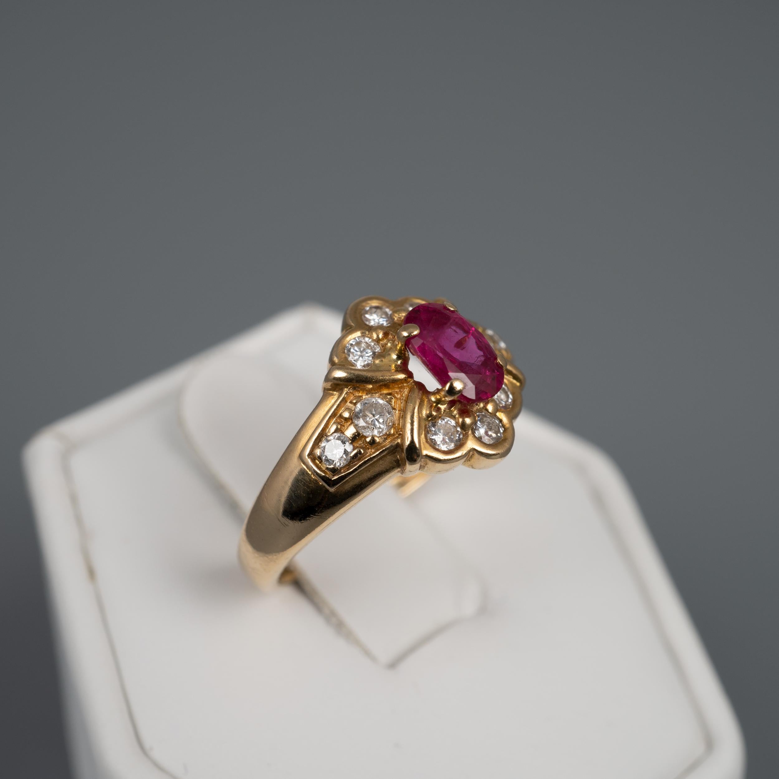 A gorgeous vintage ruby & diamond ring, made in 18 karat yellow gold, US ring size 6

The French made vintage ring features an oval prong secured ruby and 10 complimenting round cut sparkling diamonds set in upper and lower trefoils and on the