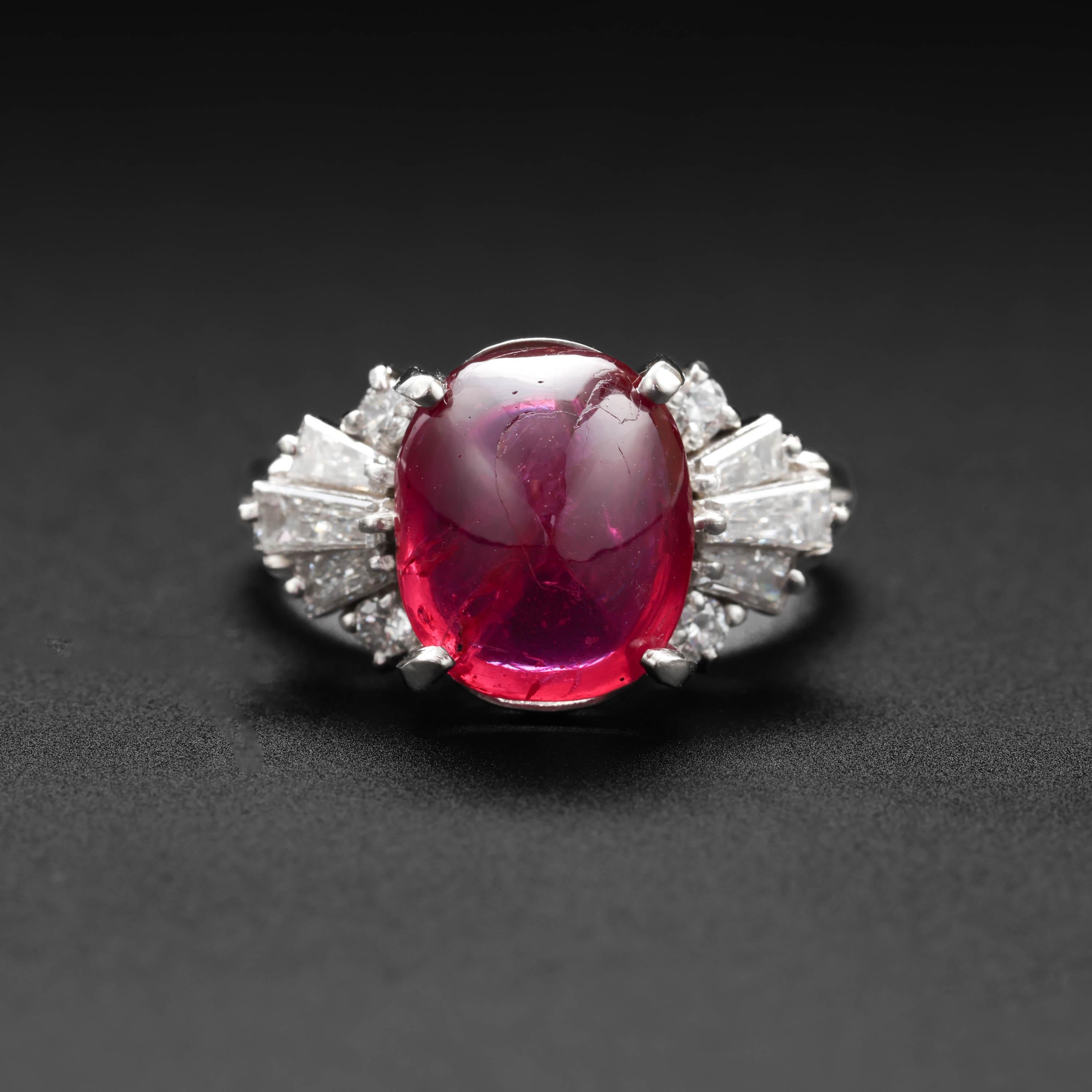 An enormous, spectacular four-carat cabochon-cut vivid pinkish-red no-heat Burma ruby commands attention in this extraordinary platinum Mid-century ring. The stoplight-red ruby measures 10.33mm x 8.74mm x 4.84mm and weighs 4.75 carats. Three sleek