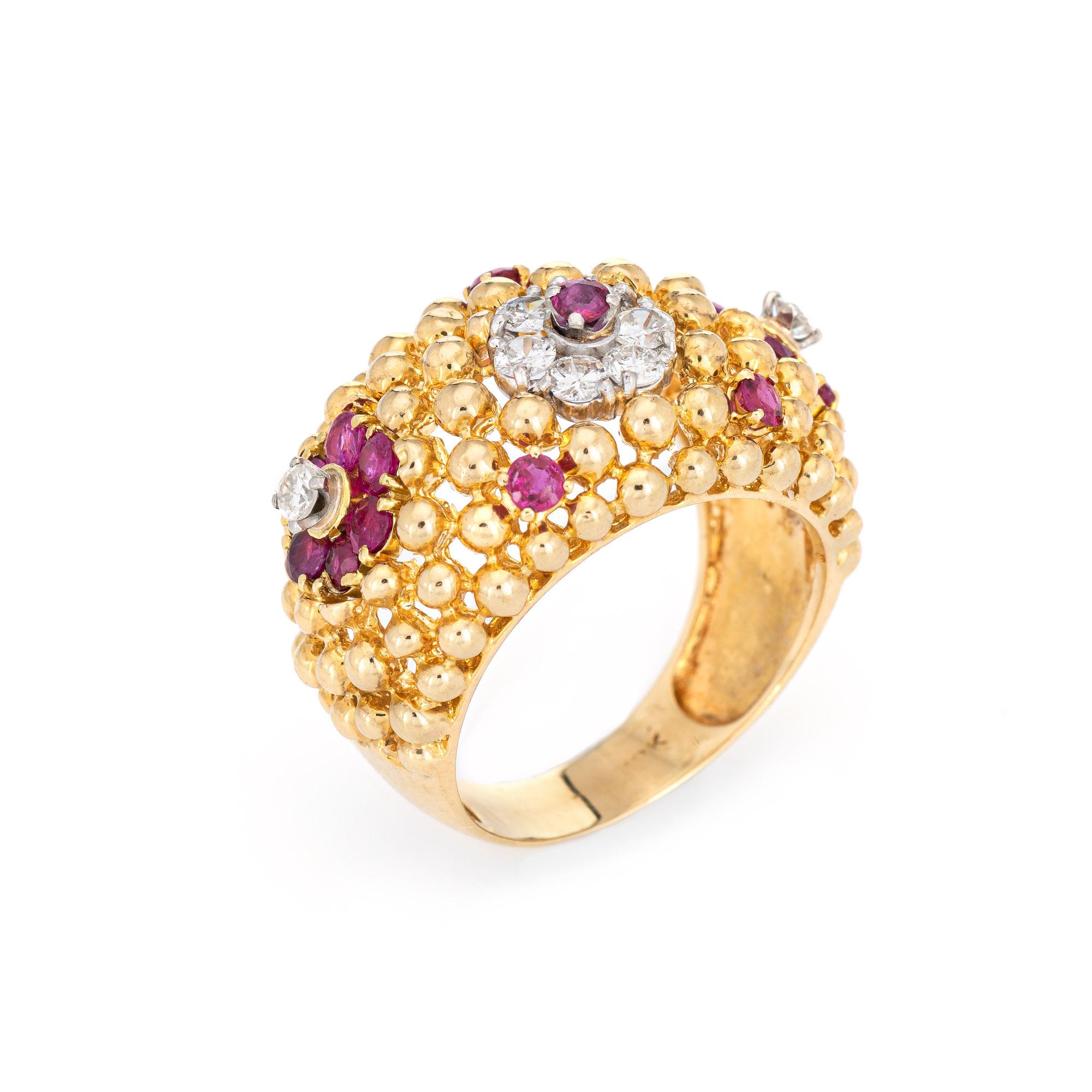 Stylish vintage ruby & diamond domed flower ring (circa 1960s to 1970s) crafted in 18 karat yellow gold. 

Round brilliant cut diamonds total an estimated 0.70 carats (estimated at G-H color and VS2-I1 clarity. Rubies total an estimated 0.90 carats.