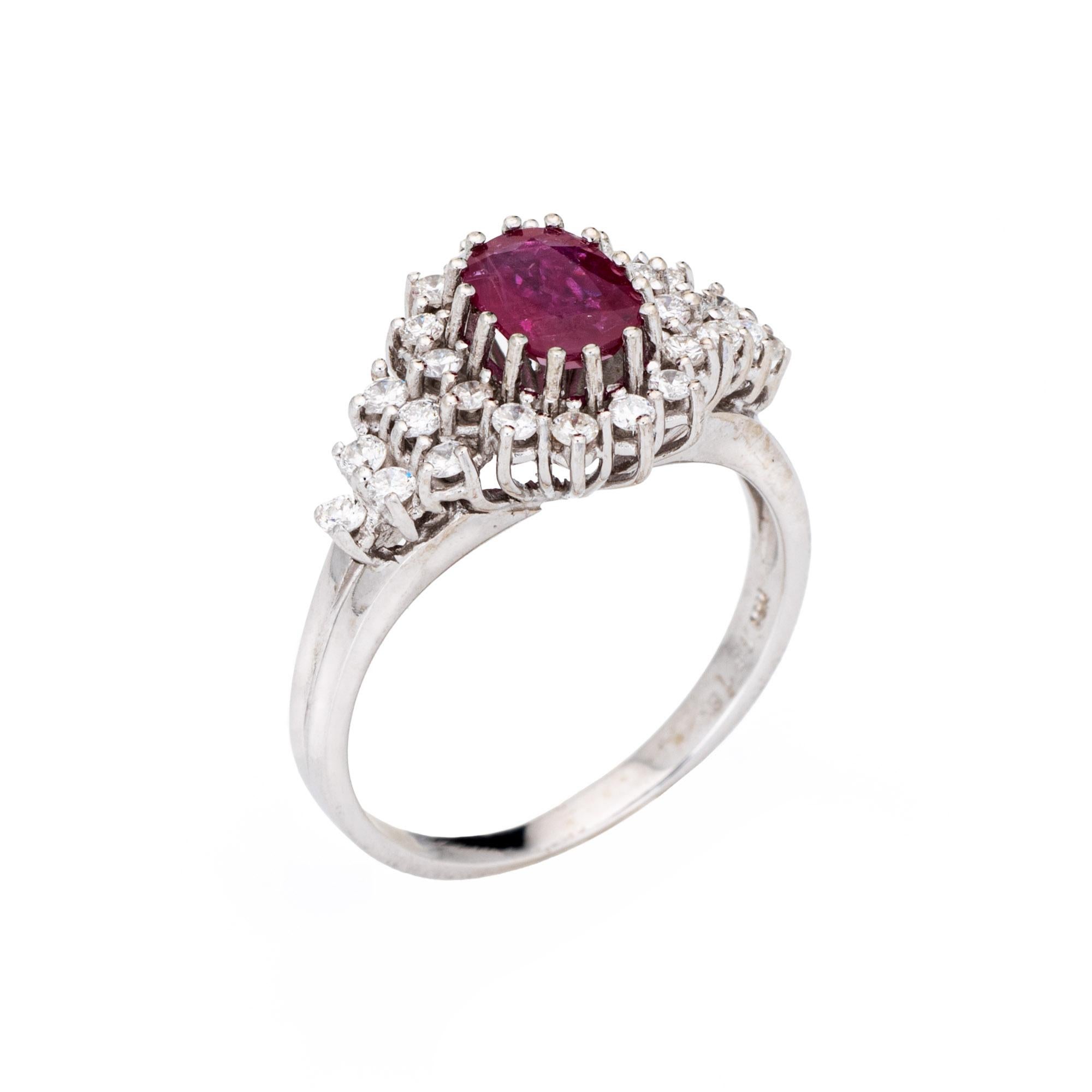 Stylish ruby & diamond cocktail ring crafted in 14 karat white gold. 

Oval faceted ruby measures 8mm x 6mm (estimated at 2 carats), accented with an estimated 0.50 carats of diamonds (estimated at H-I color and VS2-SI2 clarity). The ruby is in very