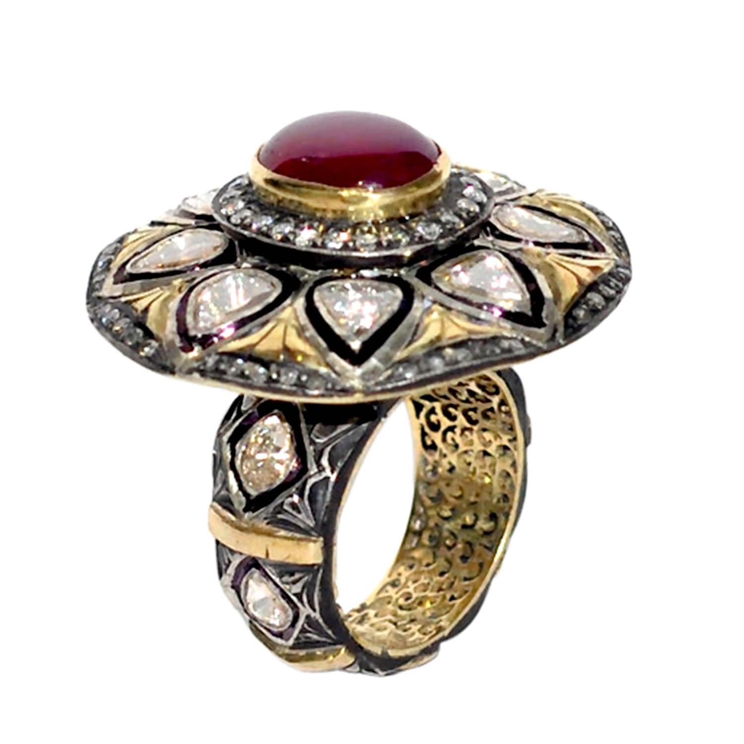 Lovely oval cocktail ring with cabochon ruby in center with polki diamonds around can be noticed from far. This ring is made with 14K yellow gold and silver.

Ring Size: 6.5

14Kt: 8.73gms
Diamond: 2.22cts
RUBY: 5.58Cts 