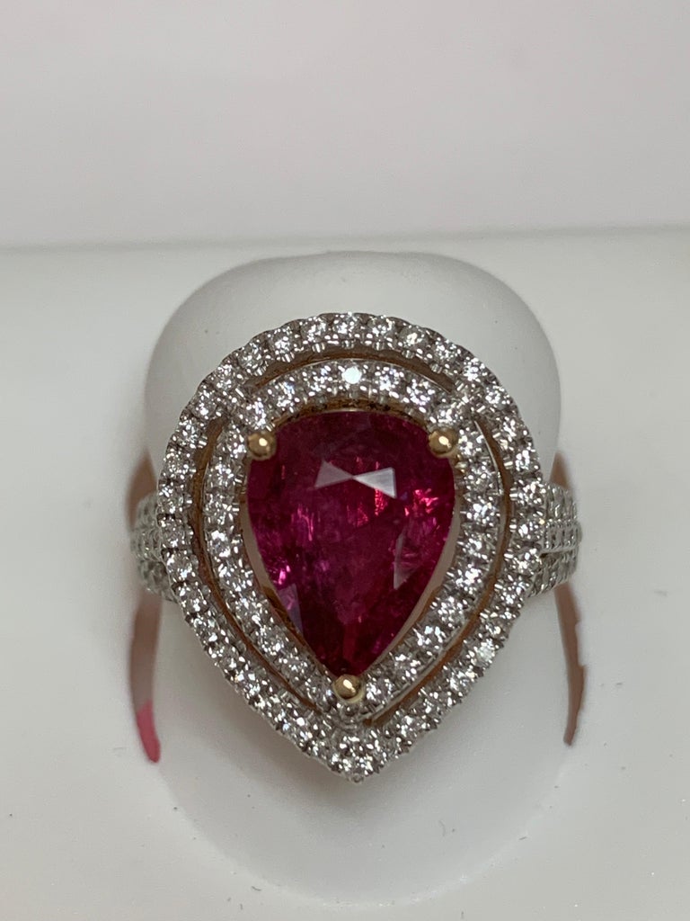 Natural Pear shape 2.55 Ruby and 0.78 Carat white diamonds set in 14 Karat yellow gold.The Ring is handcrafted one of a kind. The ring is size 7 and  can be resized if needed.