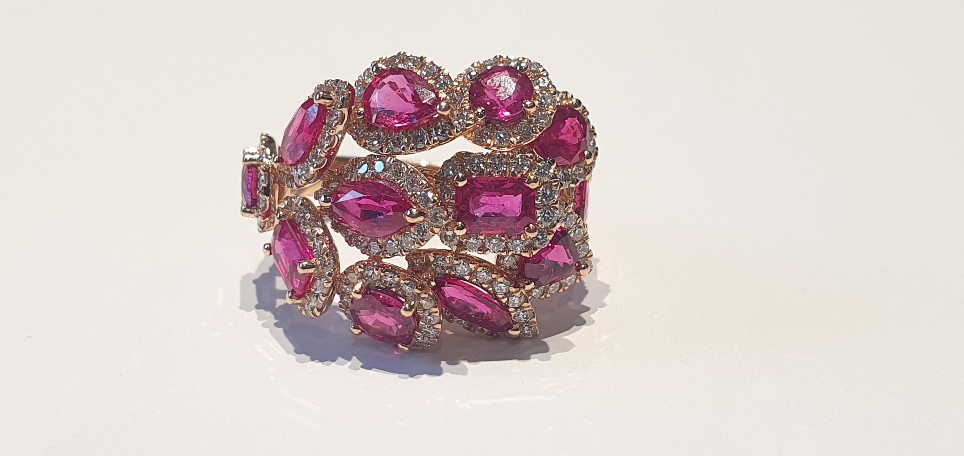 This is an exclusive & designer ring studded in 18k rose gold with 12 pieces of rubies weight 3.98 carats with 169 pieces of round shaped diamonds weight 1.28 carat, this entire ring is made of 18k rose gold weight 6.35 grams, size can be make as