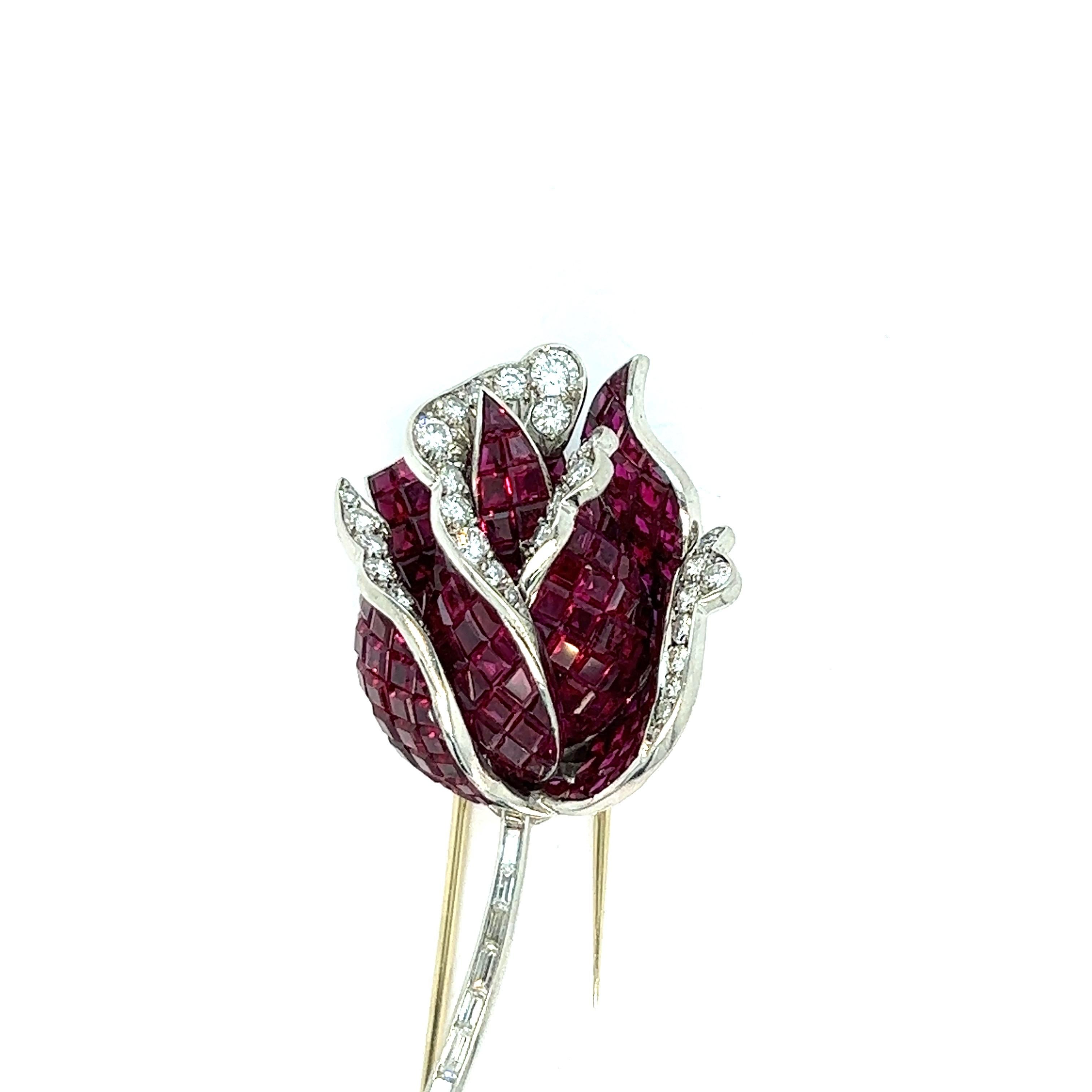 Ruby diamond rose brooch

1950s very high quality French brooch, featuring invisible rubies of approximately 35 carats and round- and baguette-cut diamonds of approximately 4.5 carats set in platinum; French maker's mark

Size: width 1.13 inches,