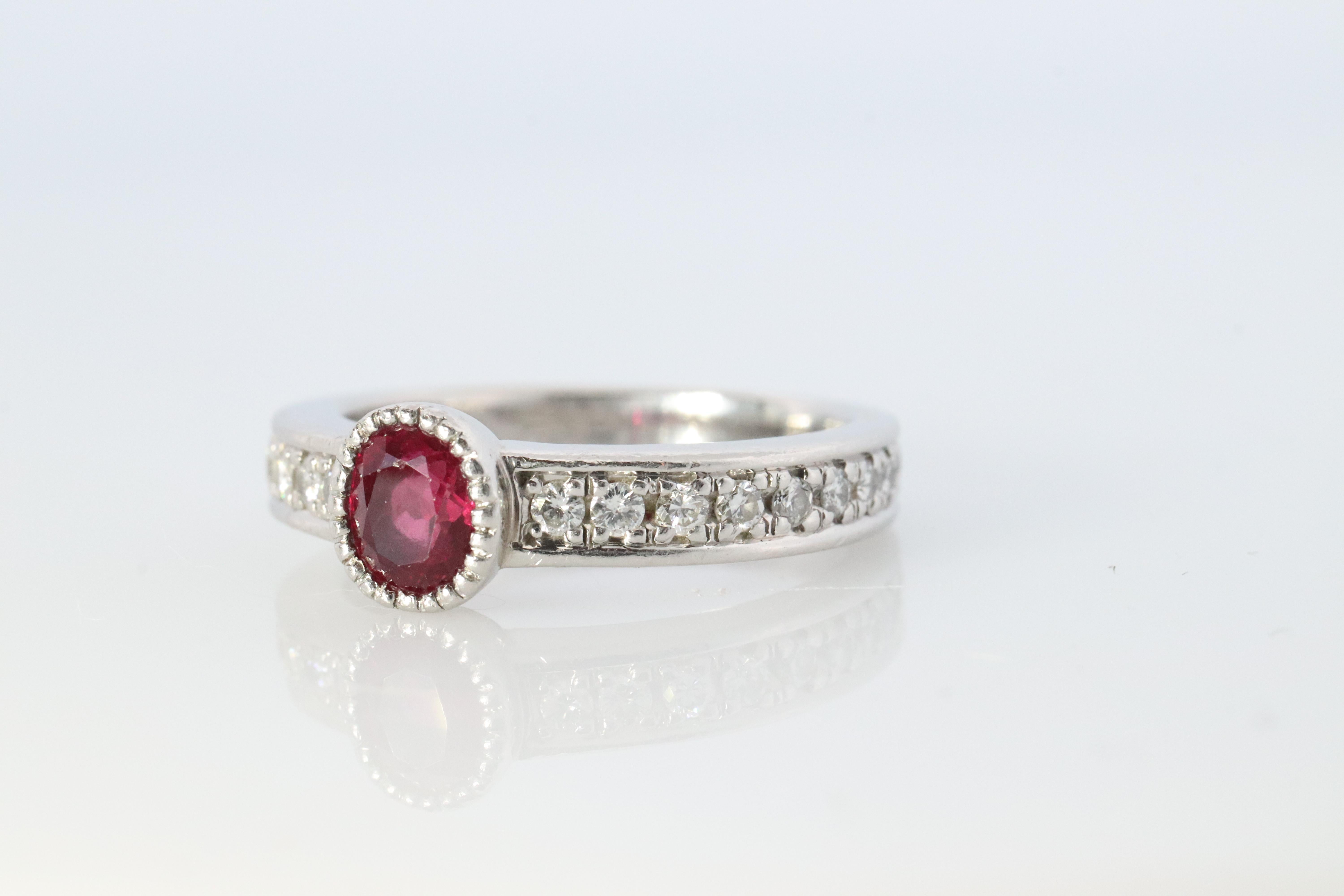 Ruby Solitaire with Diamond Band ring.

Genuine Ruby bezel set with Diamond set eternity shank.

5.4grams total weight

Details:

Size 5
1/2ct Genuine Ruby
1/3 ctw diamonds
Wonderful and RARE piece.