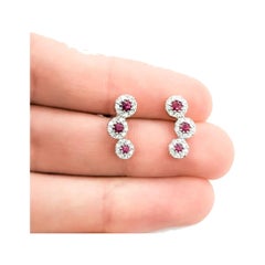 Boucles d'oreilles rubis et diamants en or blanc 14k