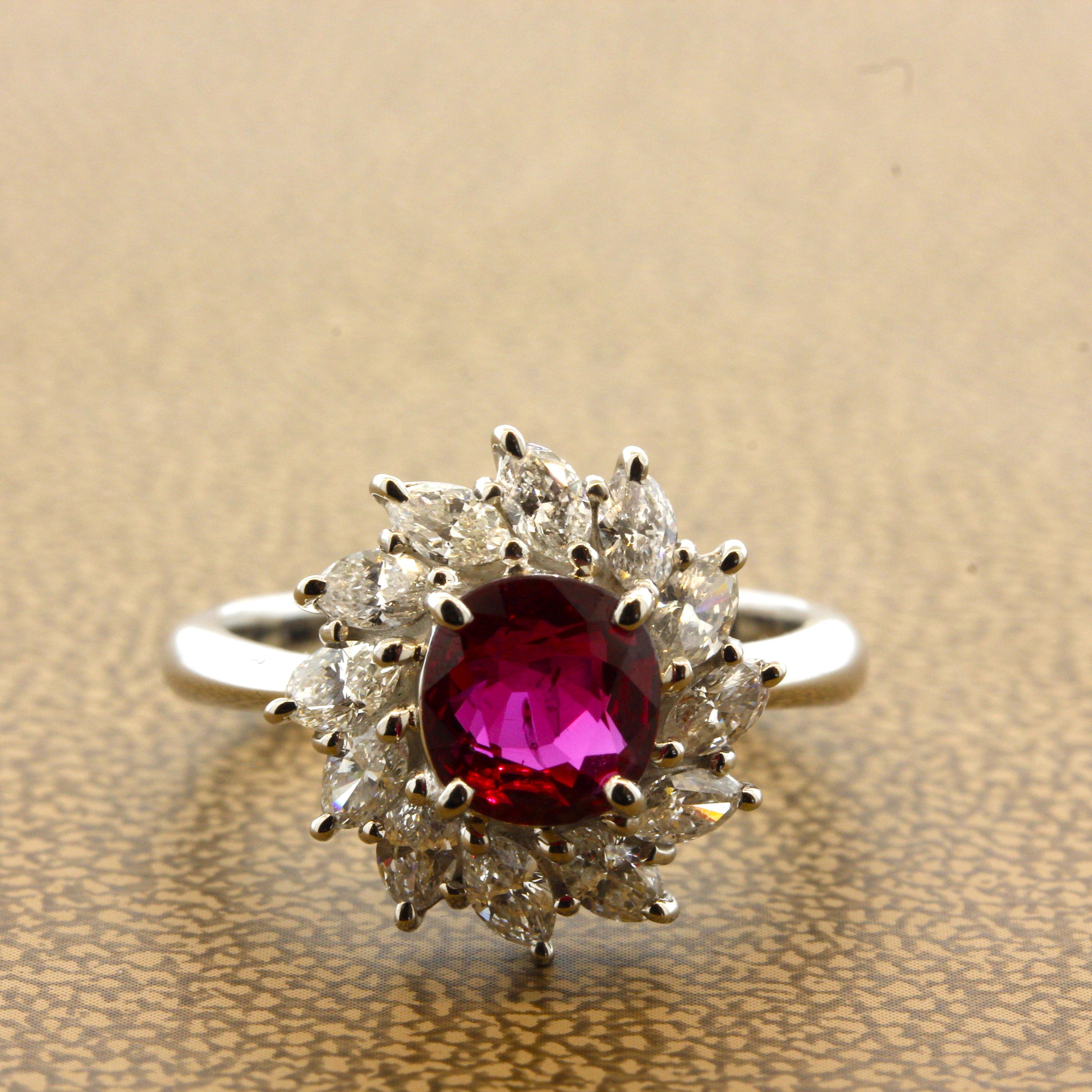 A stylish platinum made ring featuring a fine natural ruby weighing 1.42 carats. It has a lovely cushion shape along with a rich vivid red color which is still bright and brilliant, a fine stone. It is complemented by 0.96 carats of marquise shape