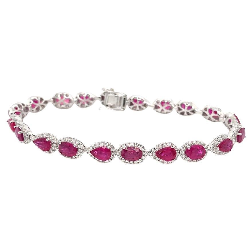 Pear & Oval Shaped rubies weighing 10.36 carats
Diamonds weighing 1.94 carats
Set in 14k white gold bracelet
Bracelet is a size 7 in