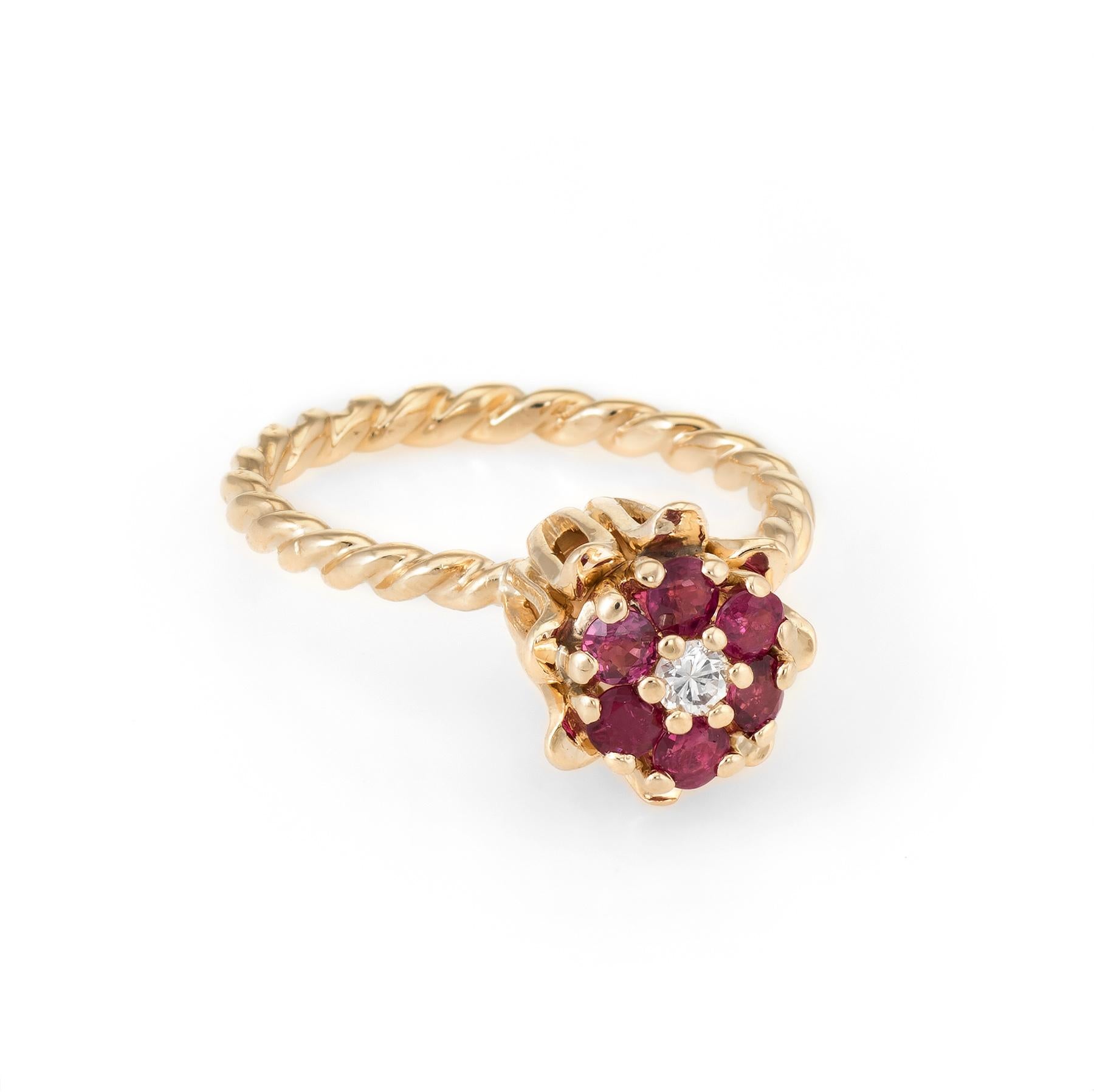 Finely detailed tulip stacking ring, crafted in 14 karat yellow gold. 

Rubies total an estimated 0.30 carats, accented with an estimated 0.05 carat round brilliant cut diamond (estimated at G-H color and VS clarity). The rubies are in excellent
