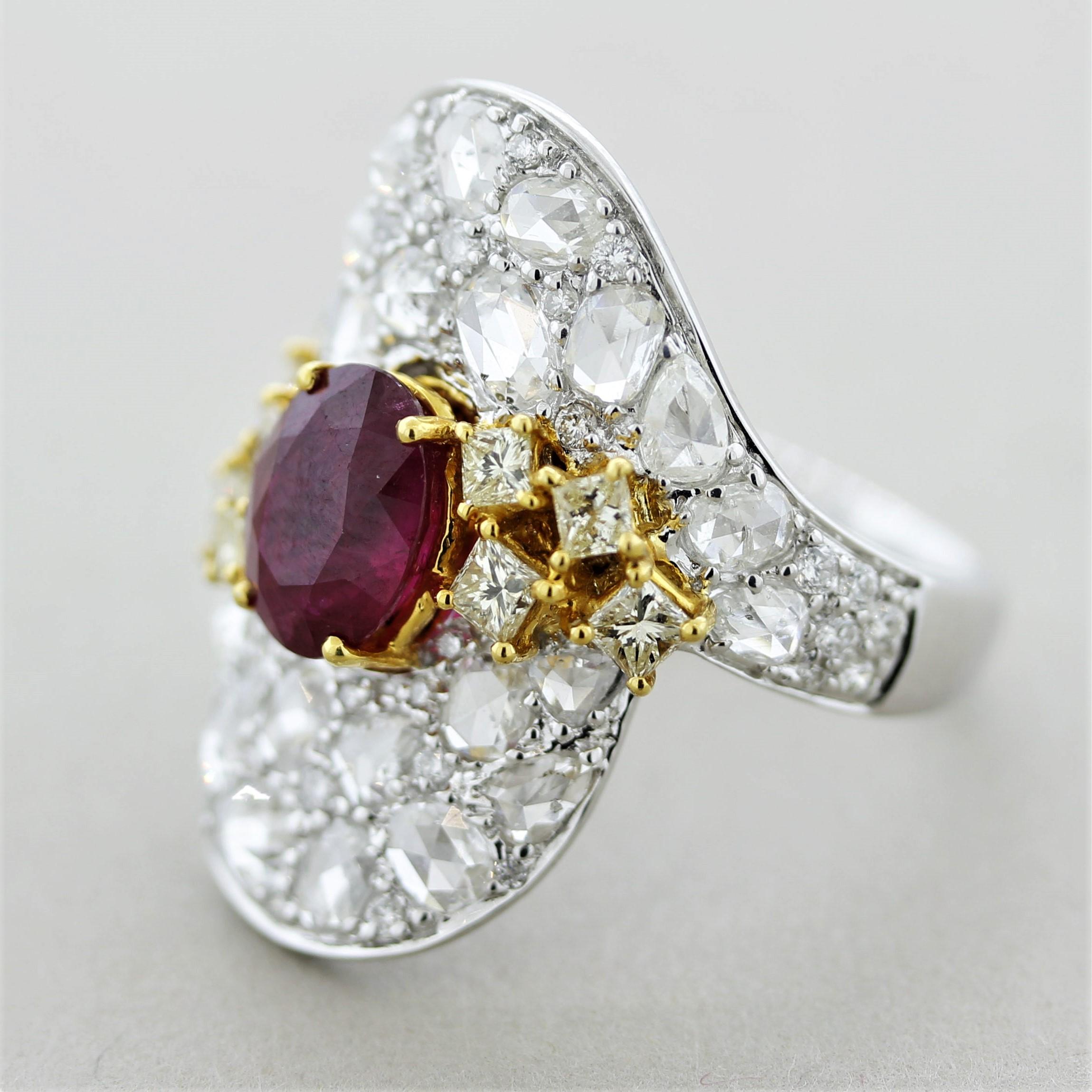 A unique and stylish ring featuring a fine oval shaped ruby and fancy shaped diamonds. The ruby has a fine intense red color with a pleasing oval shape and weighs 2.54 carats. It is accented by 3.10 carats of diamonds which include rose-cuts and