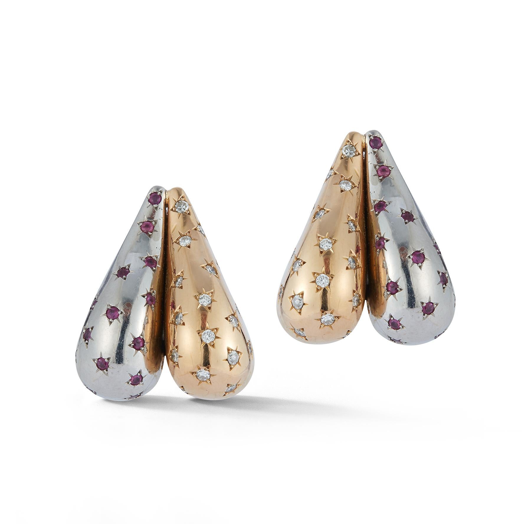 Ruby & Diamond Two Tone Retro Heart Earrings

Diamond Weight: approximately .85 cts

Ruby Weight: approximately .80 cts 

Measurements: 1.25