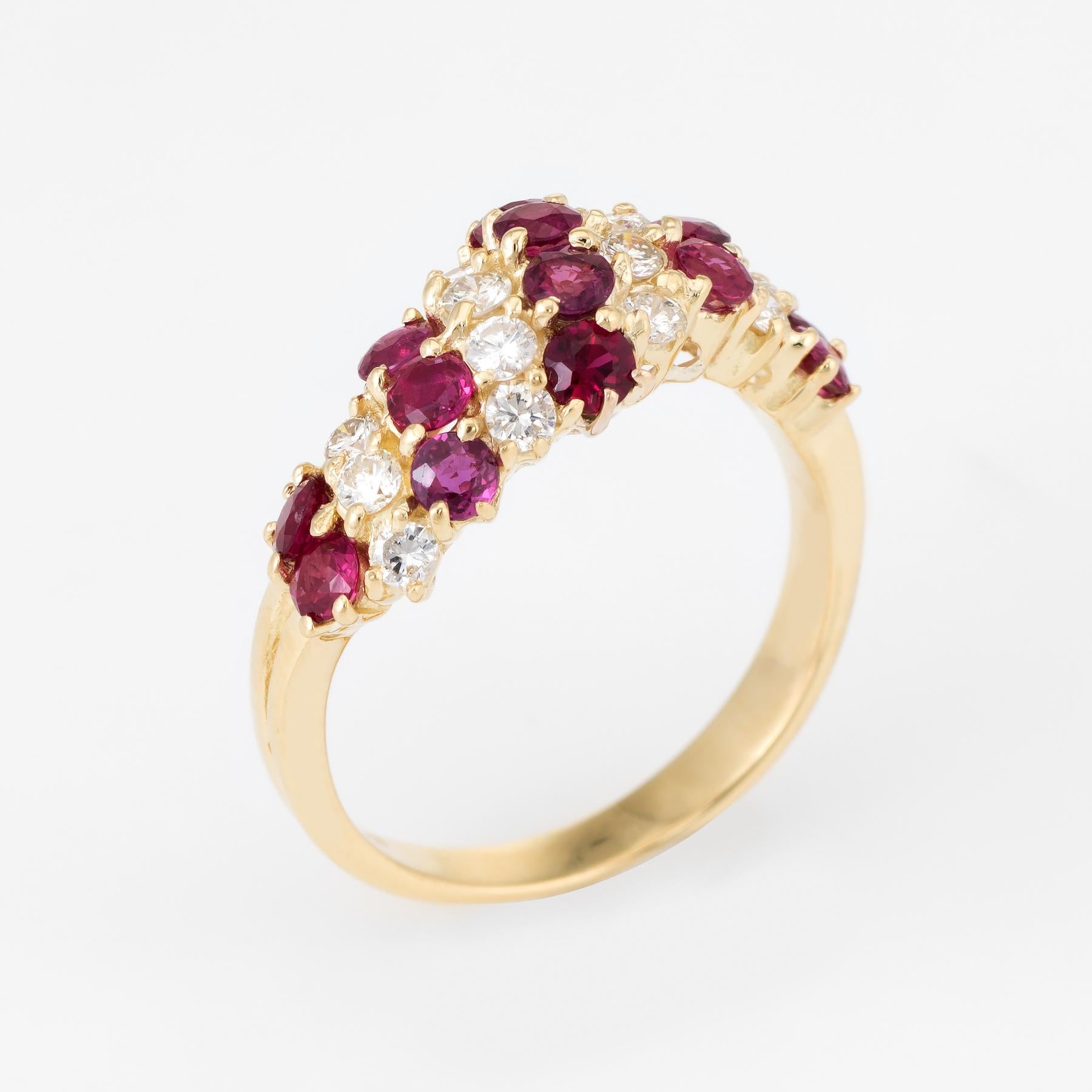 Elegant vintage band, crafted in 18 karat yellow gold. 

14 round brilliant cut diamonds are estimated at 0.03 carats each and total an estimated 0.42 carats (estimated at G-H color and VS clarity), accented with 14 estimated 0.06 carat rubies (0.84
